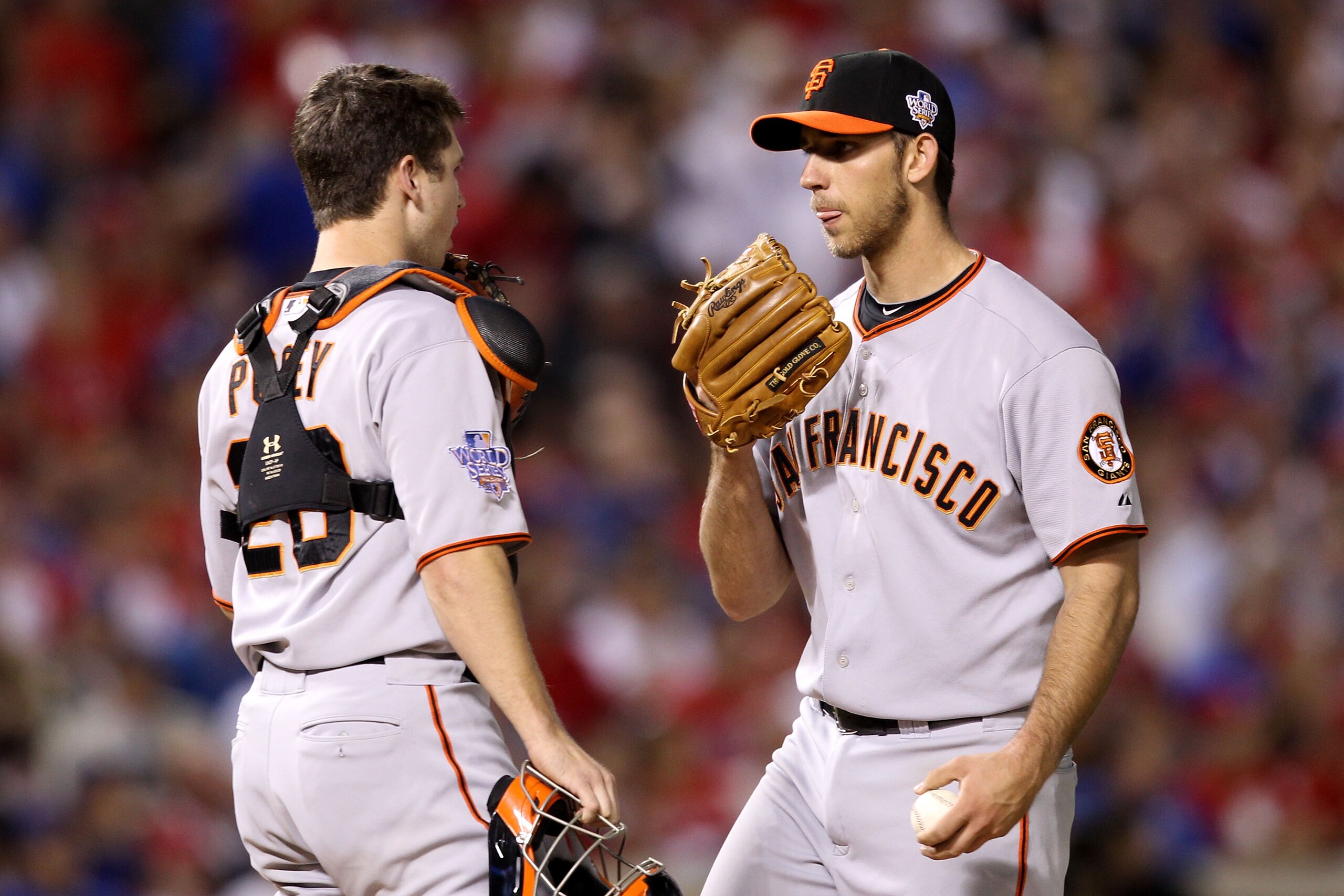 ARLINGTON, TX - OCTOBER 31:  Starting pitcher Madison Bumgarner #40 of the San Francisco Giants talks with catcher Buster Posey #28 against the Texas Rangers in Game Four of the 2010 MLB World Series at Rangers Ballpark in Arlington on October 31, 2010 in