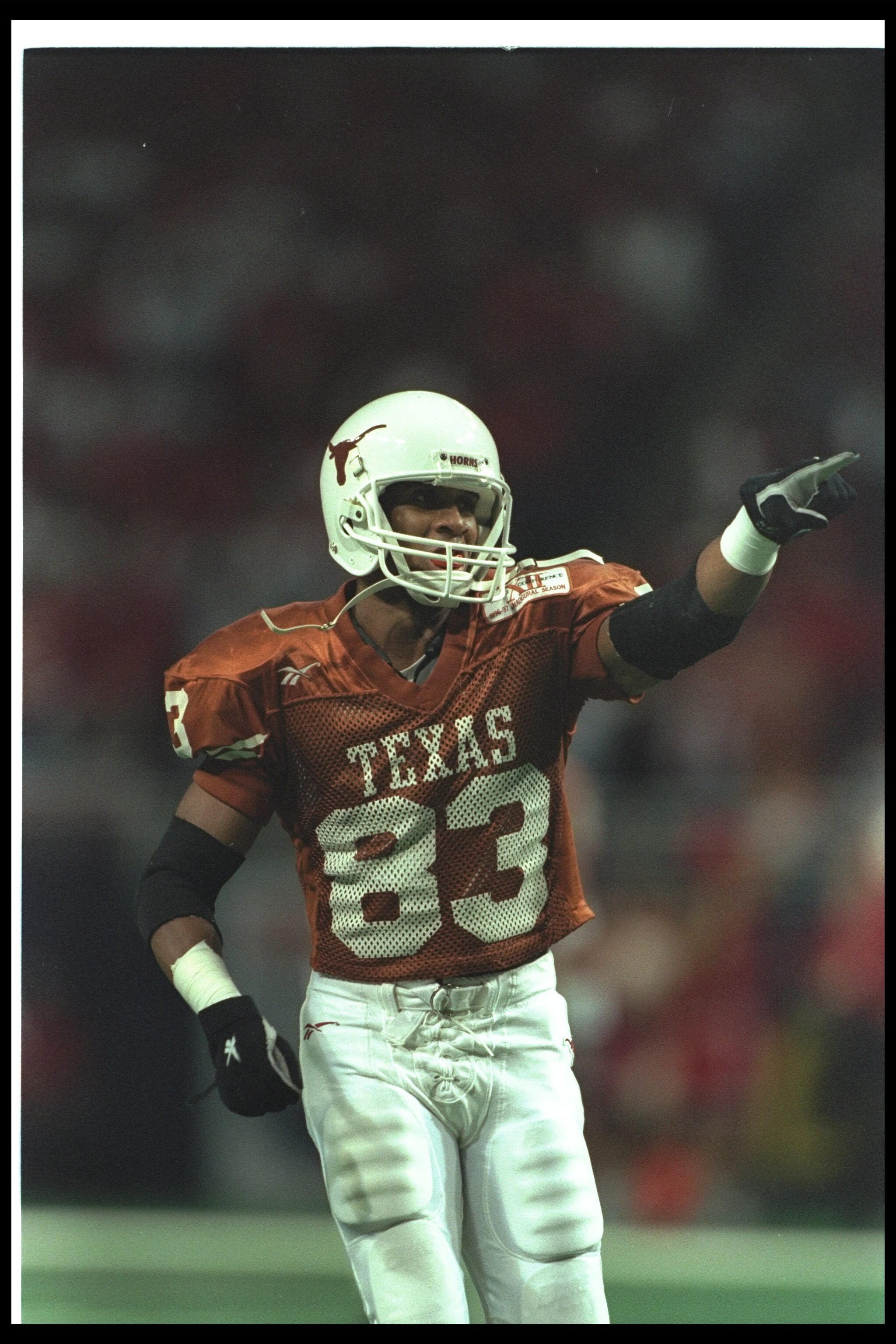 7 Dec 1996:  Wide receiver Mike Adams of the Texas Longhorns celebrates during the Big 12 Championship game against the Nebraska Cornhuskers at the TWA Dome in St. Louis, Missouri.  Texas won the game, 39-27.  Mandatory Credit: Jed Jacobsohn  /Allsport