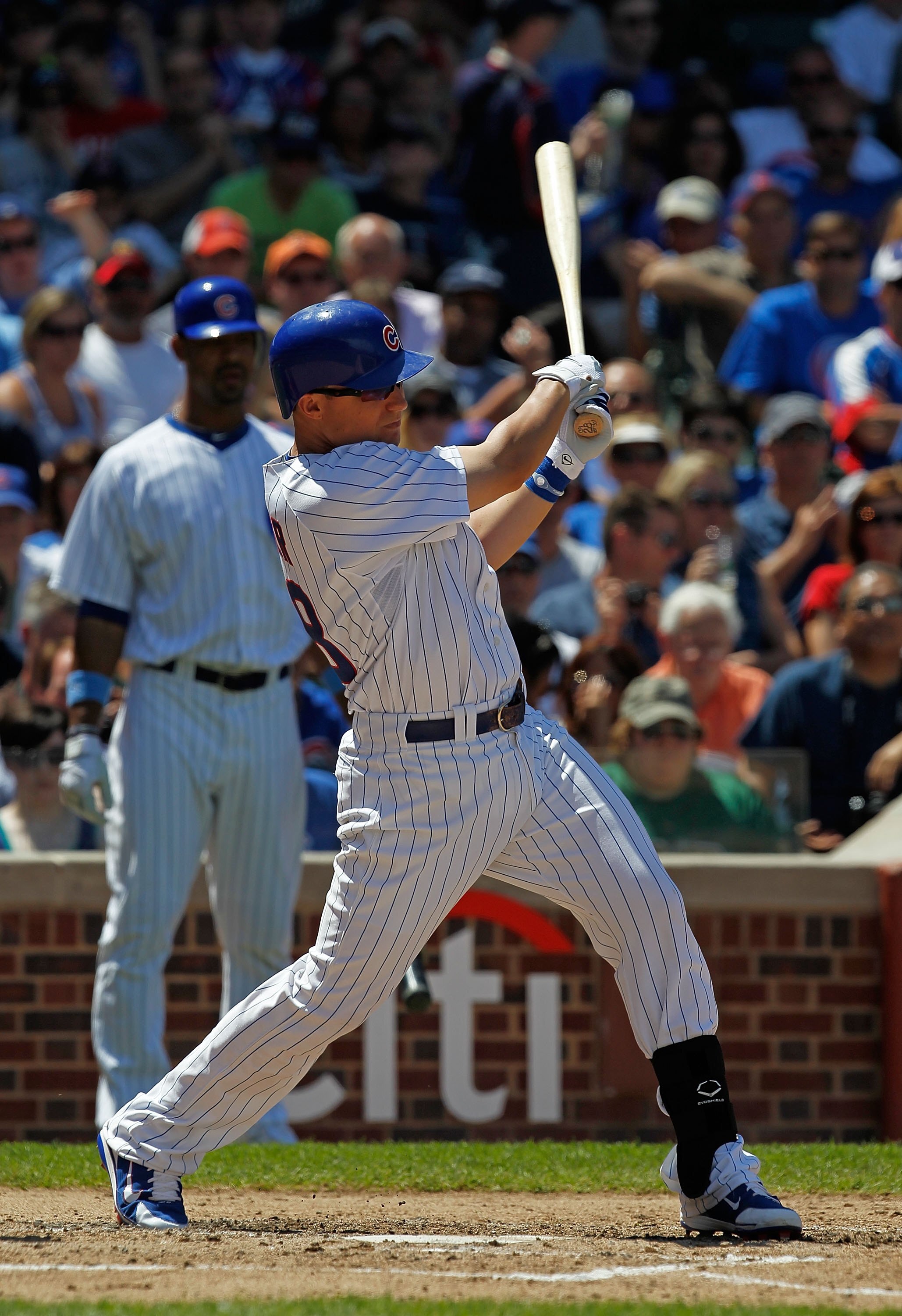 CHICAGO - JUNE 20: Jeff Baker #28 of the Chicago Cubs hits the ball against the Los Angeles Angels of Anaheim at Wrigley Field on June 20, 2010 in Chicago, Illinois. The Cubs defeated the Angels 12-1. (Photo by Jonathan Daniel/Getty Images)