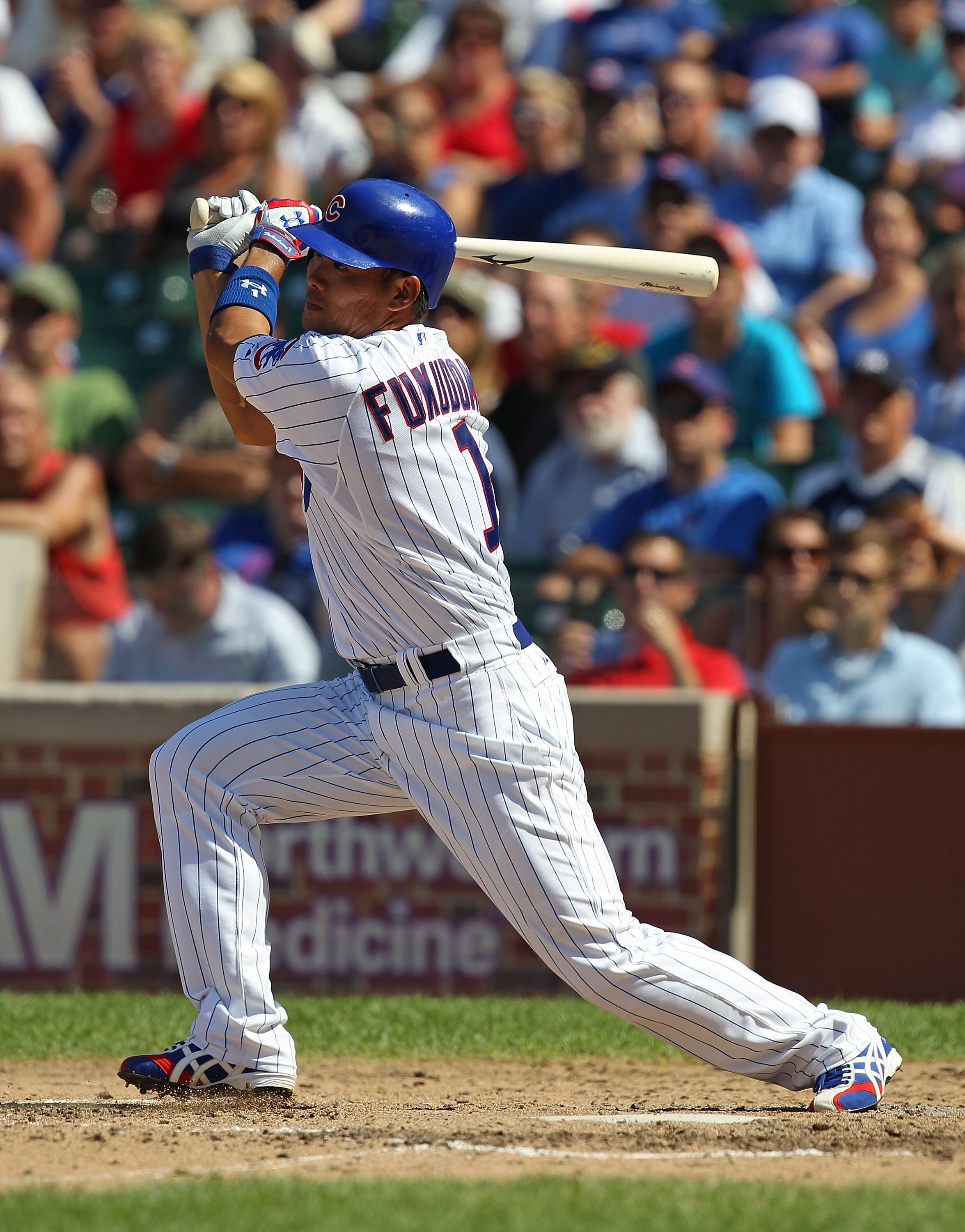 CHICAGO - JULY 21: Kosuke Fukudome #1 of the Chicago Cubs hit the ball against the Houston Astros at Wrigley Field on July 21, 2010 in Chicago, Illinois. The Astros defeated the Cubs 4-3 in 12 innings.  (Photo by Jonathan Daniel/Getty Images)