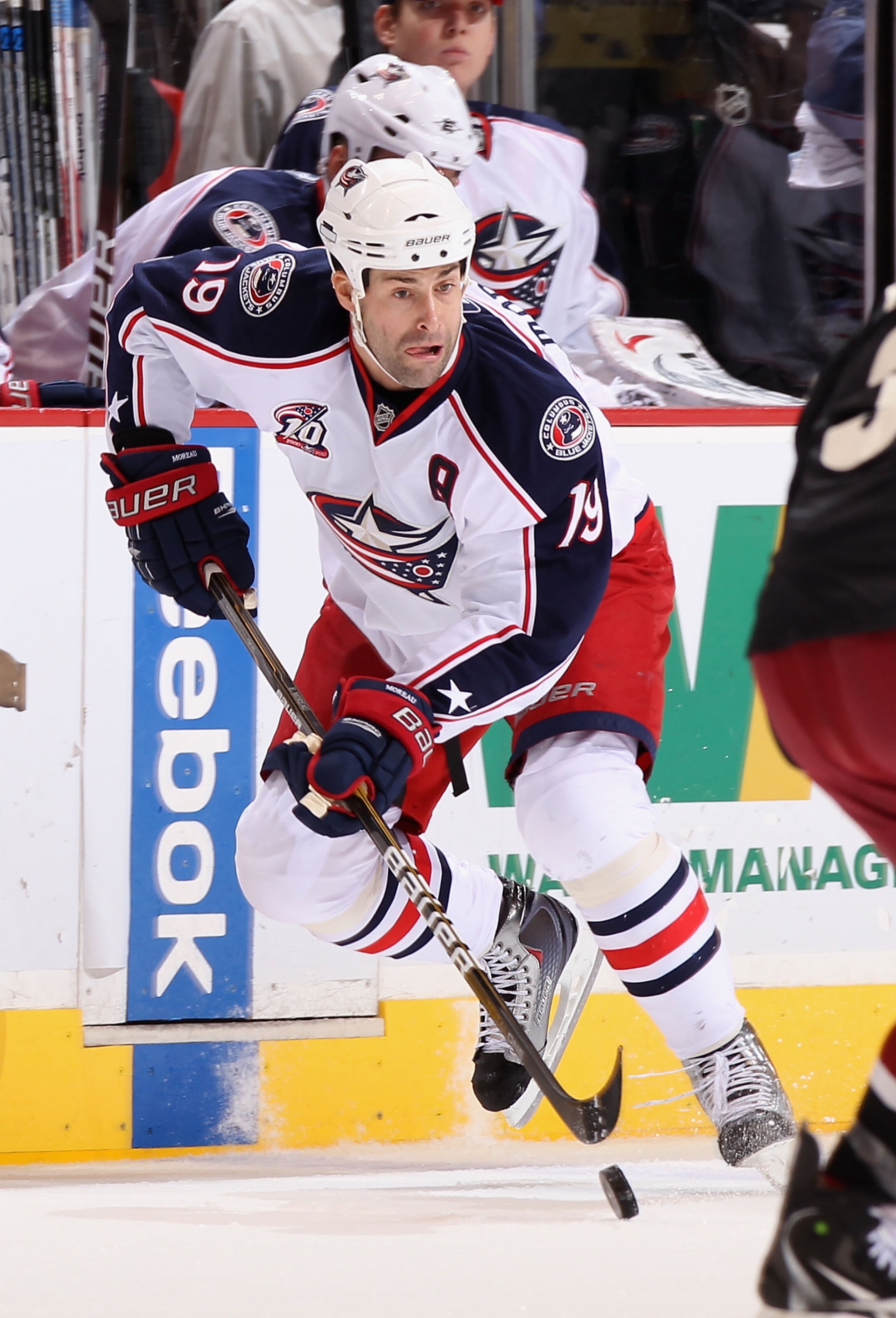 GLENDALE, AZ - JANUARY 04:  Ethan Moreau #19 of the Columbus Blue Jackets skates with the puck during the NHL game against the Phoenix Coyotes at Jobing.com Arena on January 4, 2011 in Glendale, Arizona.  The Coyotes defeated the Blue Jackets 4-2.  (Photo