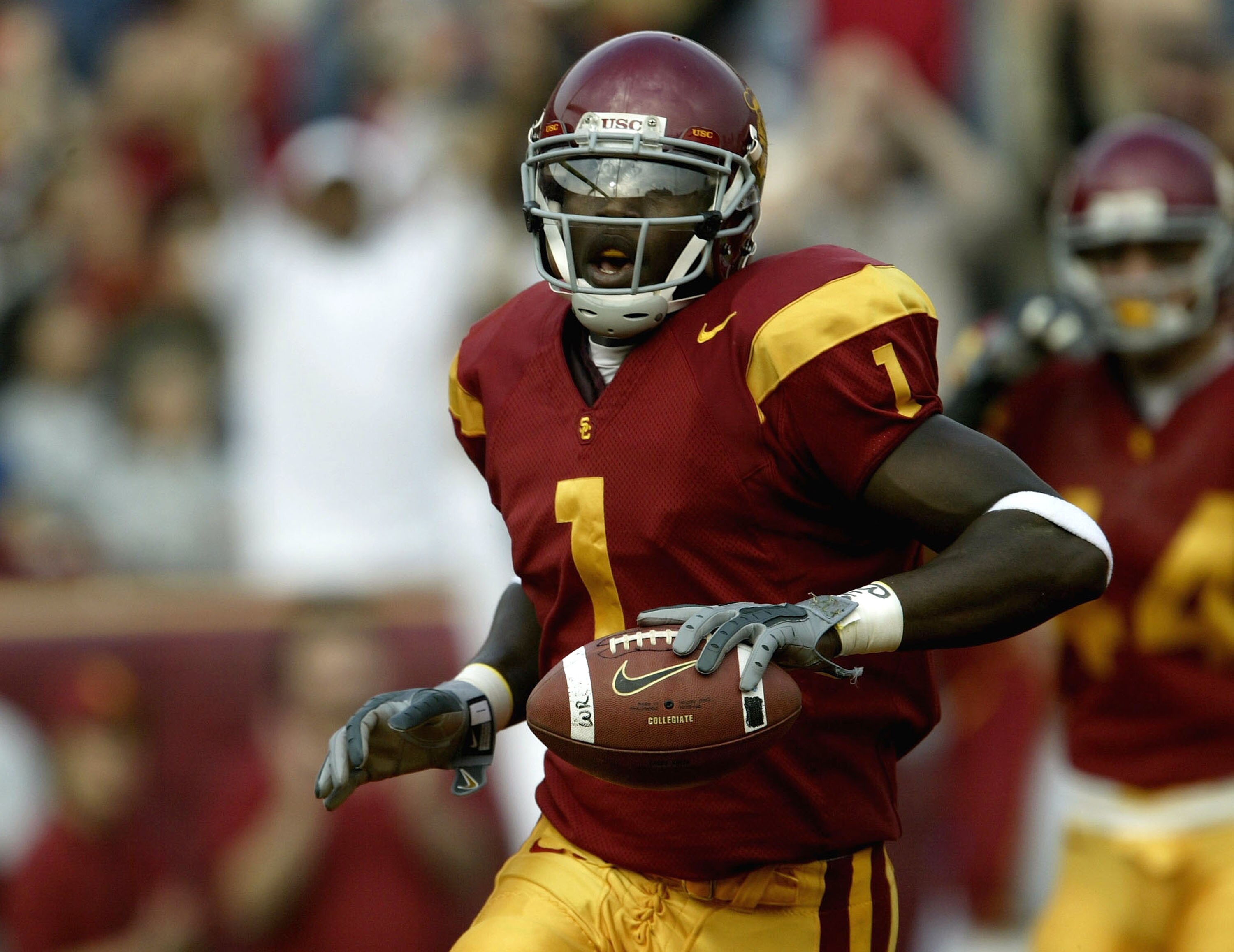 LOS ANGELES - DECEMBER 6:  Wide receiver Mike Williams #1 of the USC Trojans celebrates a touchdown reception against the Oregon State Beavers on December 6, 2003 at the Los Angeles Coliseum in Los Angeles, California.  (Photo by Stephen Dunn/Getty Images