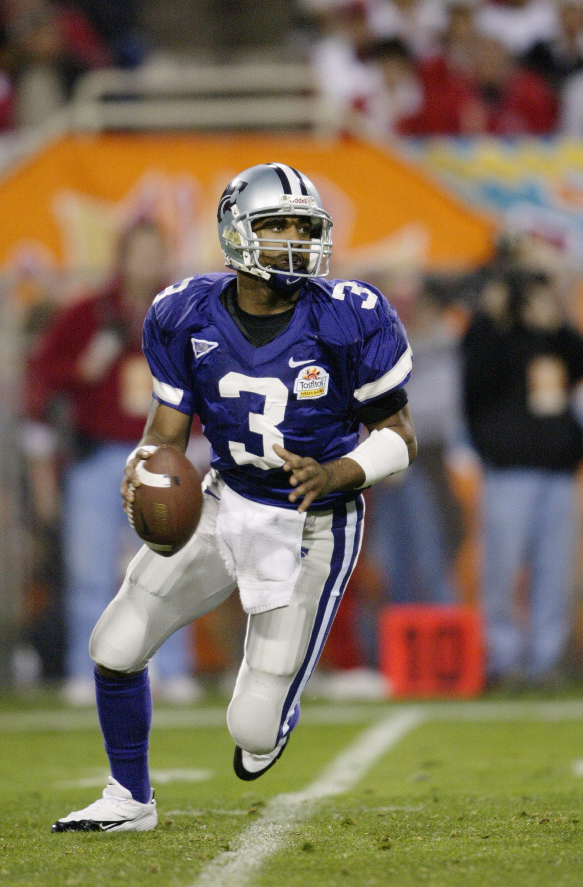 TEMPE, ARIZONA - JANUARY 2:  Quarterback Ell Roberson #3 of the Kansas State Wildcats drops back to pass during the game against the Ohio State Buckeyes in the Tostitos Fiesta Bowl on January 2, 2004 at Sun Devil Stadium in Tempe, Arizona. The Buckeyes de
