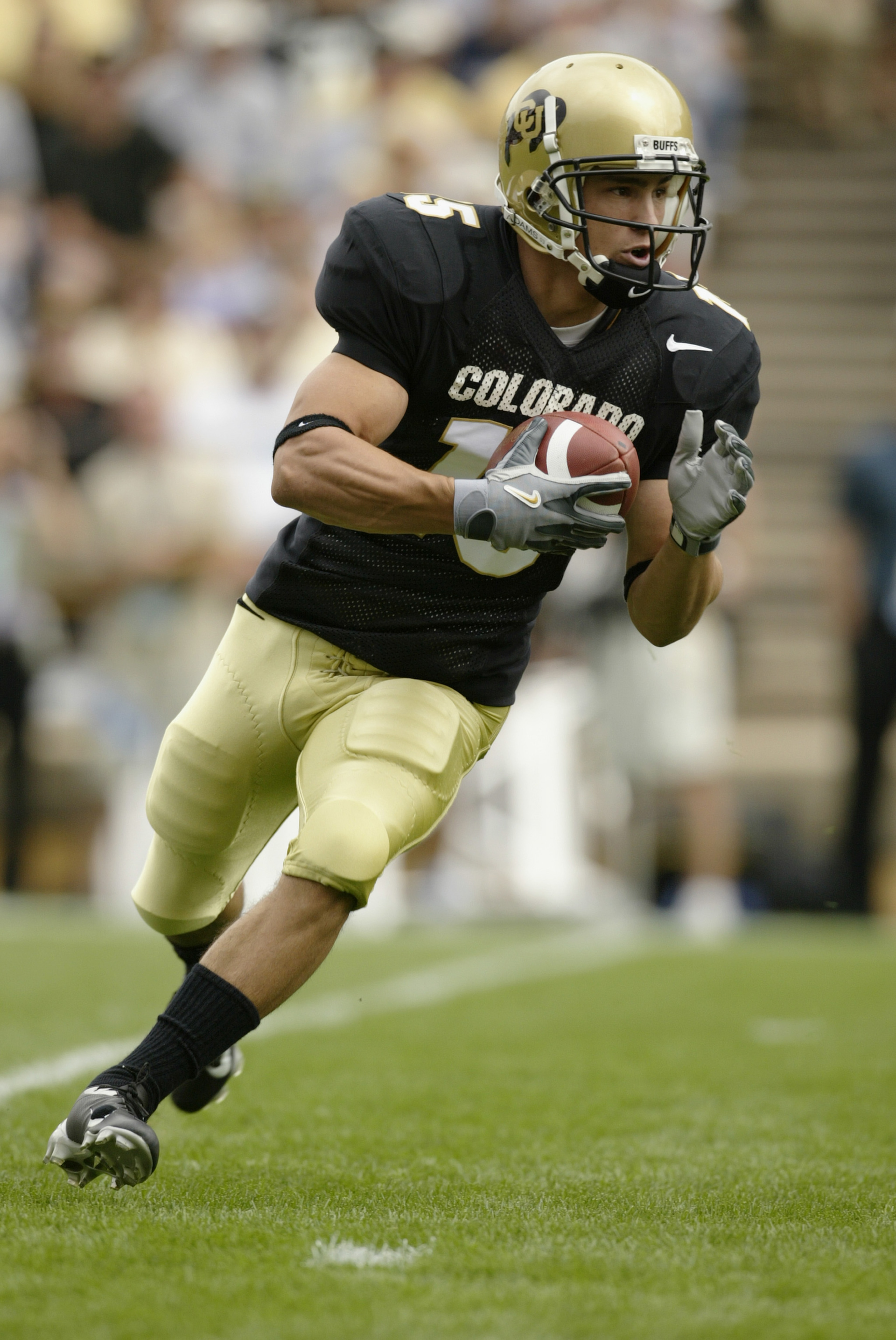 BOULDER, CO - SEPTEMBER 6: Wide receiver Jeremy Bloom #15 of the Colorado Buffaloes runs a reverse against the UCLA Bruins on September 6, 2003 at Folsom Field in Boulder, Colorado. Colorado defeated UCLA 16-14. (Photo by Brian Bahr/Getty Images) BOULDER, CO - SEPTEMBER 6: Wide receiver Jeremy Bloom #15 of the Colorado Buffaloes runs a reverse against the UCLA Bruins on September 6, 2003 at Folsom Field in Boulder, Colorado. Colorado defeated UCLA 16-14. (Photo by Brian Bahr/Getty Images)