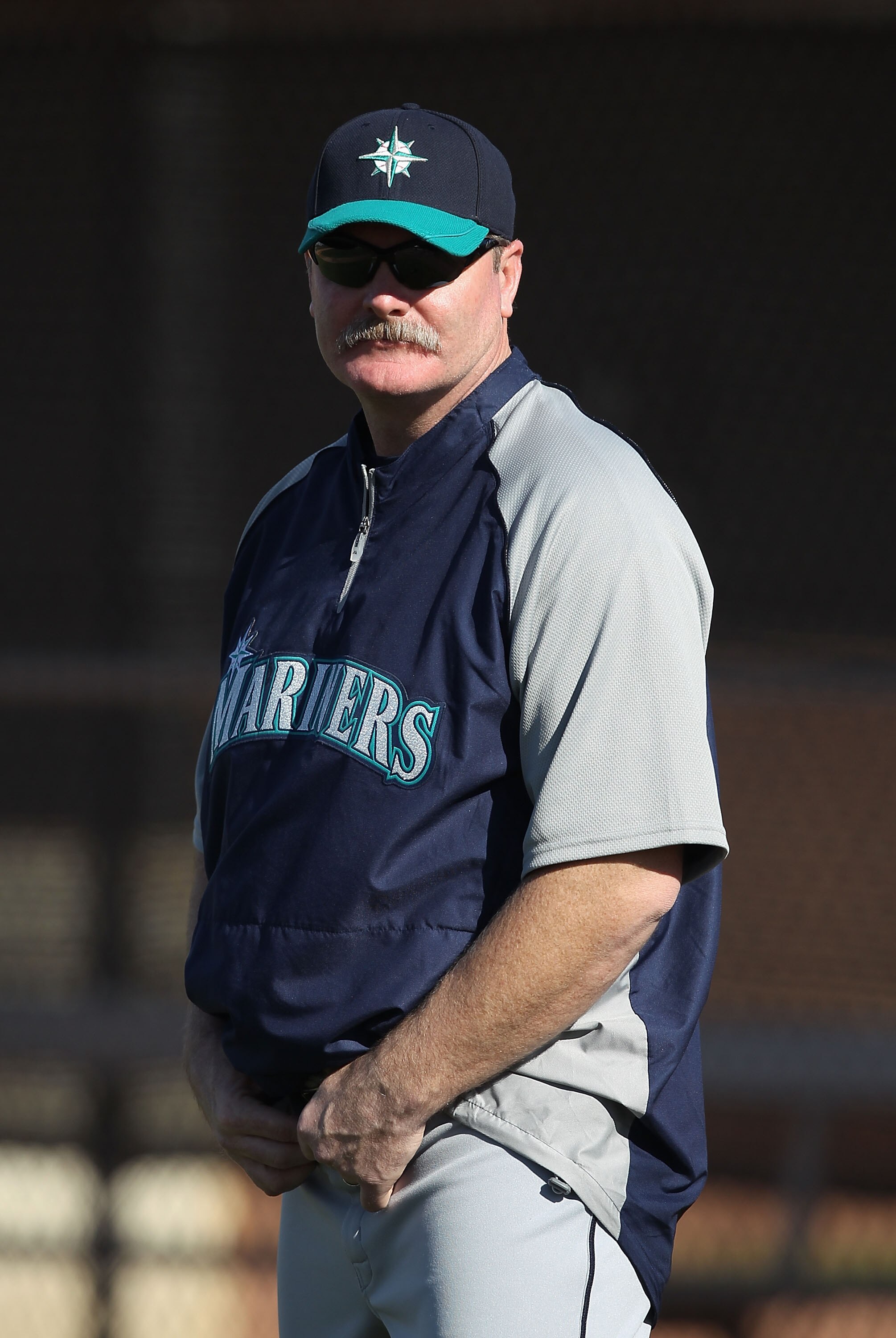 PEORIA, AZ - FEBRUARY 15:  Manager Eric Wedge of the Seattle Mariners watches team drills during a MLB spring training practice at Peoria Stadium on February 15, 2011 in Peoria, Arizona.  (Photo by Christian Petersen/Getty Images)