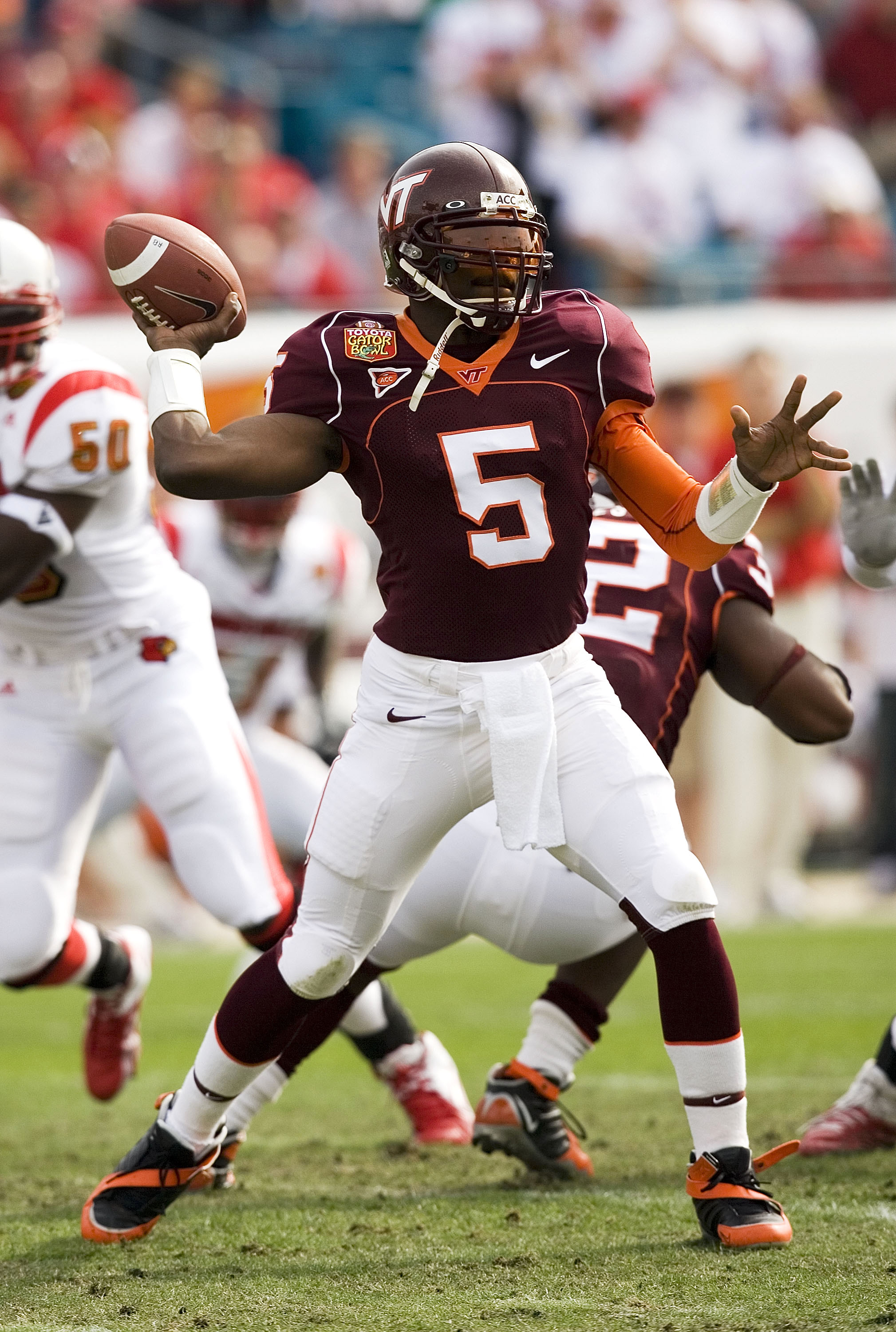 JACKSONVILLE, FL - JANUARY 2:  Marcus Vick #5 of the Virginia Tech Hokies drops back to pass against the Louisville Cardinals during the Toyota Gator Bowl on January 2, 2006 at Alltel Stadium in Jacksonville, Florida. The Hokies defeated the Cardinals 35-