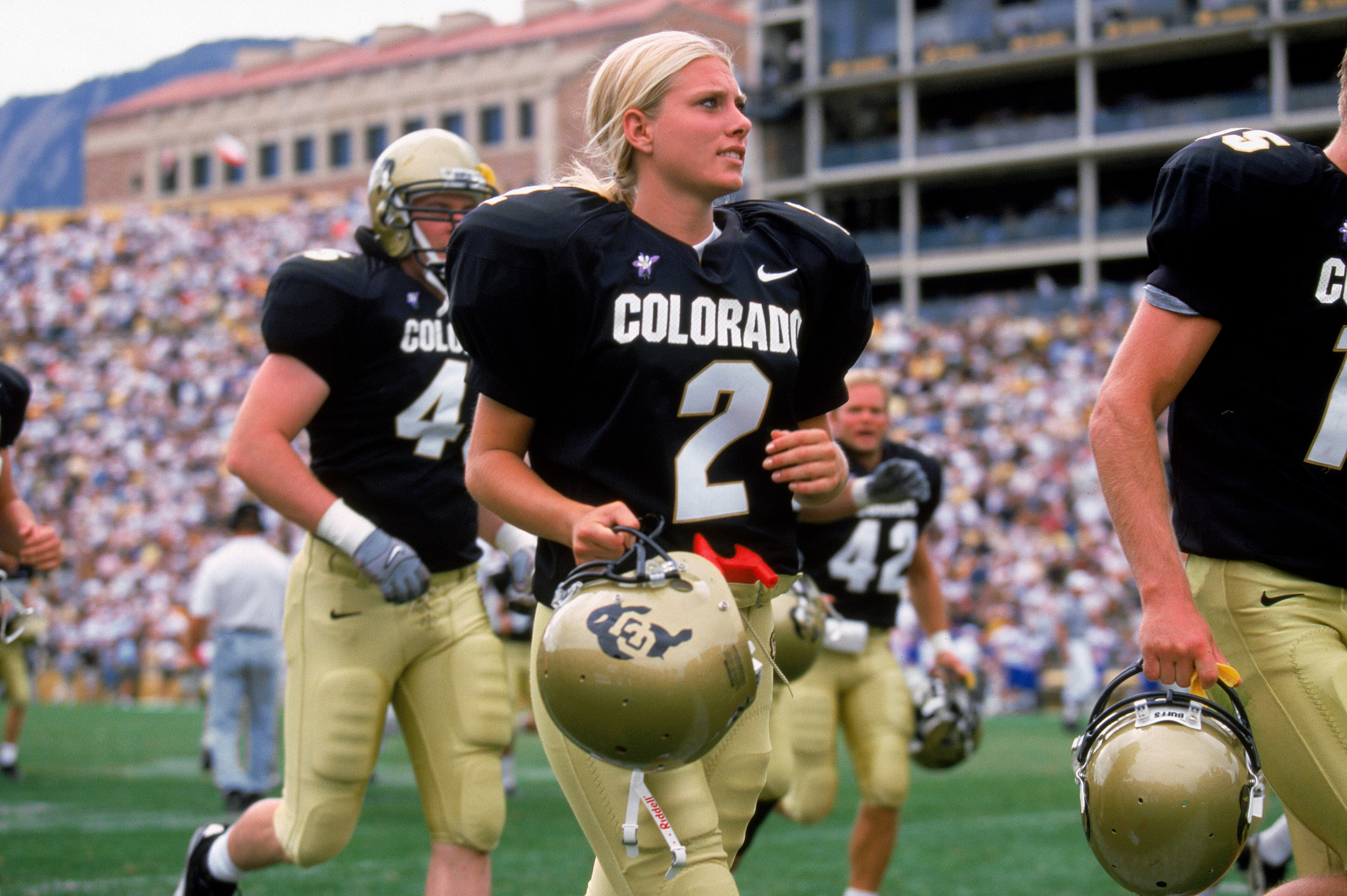 BOULDER, CO - SEPTEMBER 18: Katie Hnida of the University of Colorado heads off the field during the game against the University of Kansas at Folsom Field on September 18, 1999 in Boulder, Colorado. The University of Colorado won 51-17. (Photo by Brian BOULDER, CO - SEPTEMBER 18: Katie Hnida of the University of Colorado heads off the field during the game against the University of Kansas at Folsom Field on September 18, 1999 in Boulder, Colorado. The University of Colorado won 51-17. (Photo by Brian
