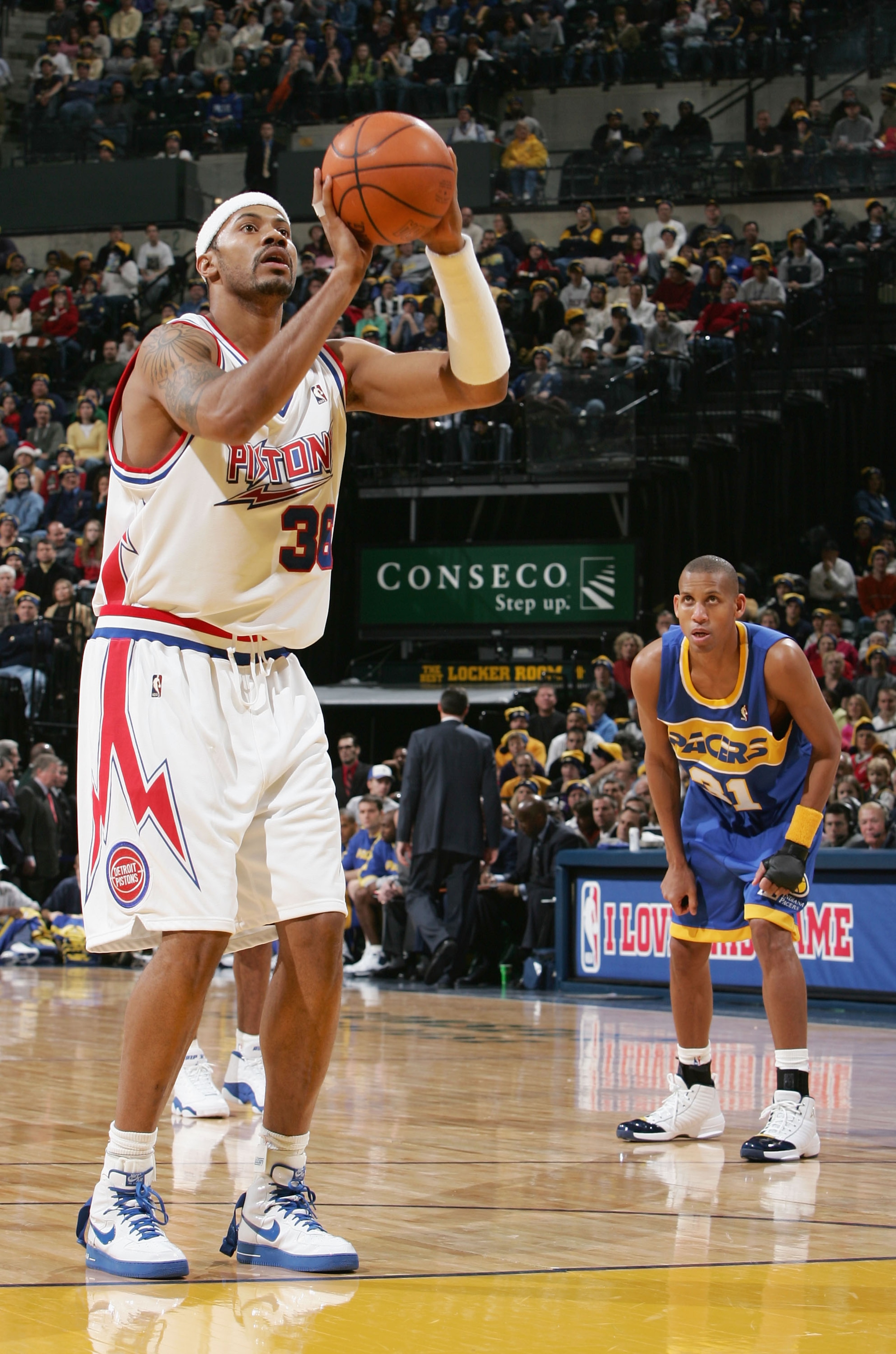 INDIANAPOLIS, IN - DECEMBER 25:  Rasheed Wallace #36 of the Detroit Pistons shoots a free throw shot as Reggie Miller #31 of the Indiana Pacers during the game on December 25, 2004 at Conseco Field House in Indianapolis, Indiana.  The Pistons defeated the