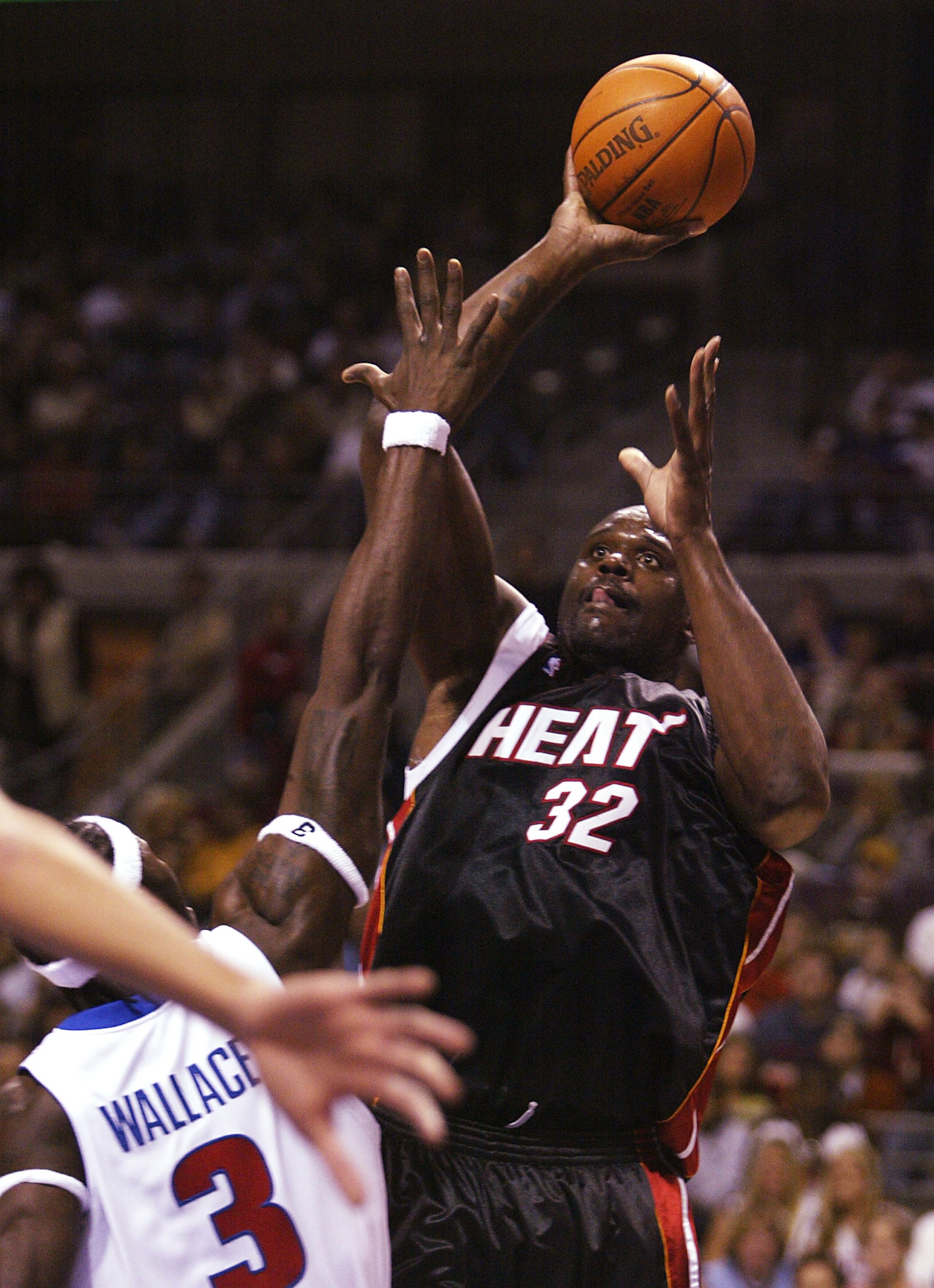 AUBURN HILLS, MI - DECEMBER 30:  Shaquille O'Neal #32 of the Miami Heat shoots over Ben Wallace #3 of the Detroit Pistons in the first quarter on December 30, 2004 at The Palace of Auburn Hills in Auburn Hills, Michigan. NOTE TO USER: User expressly ackno