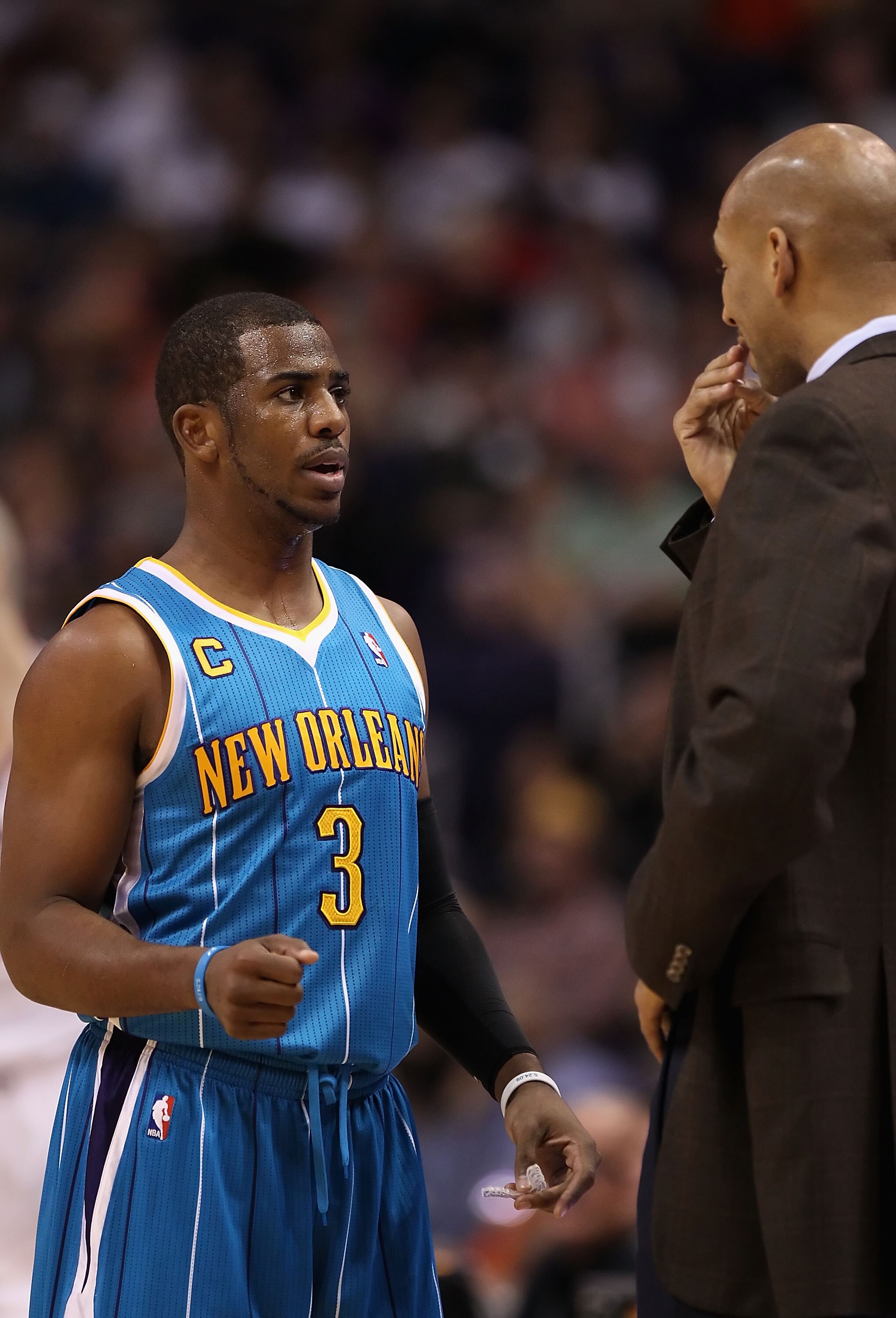 PHOENIX, AZ - JANUARY 30:  Chris Paul #3 of the New Orleans Hornets talks with head coach Monty Williams during the NBA game against the Phoenix Suns at US Airways Center on January 30, 2011 in Phoenix, Arizona. The Suns defeated the Hornets 104-102. NOTE