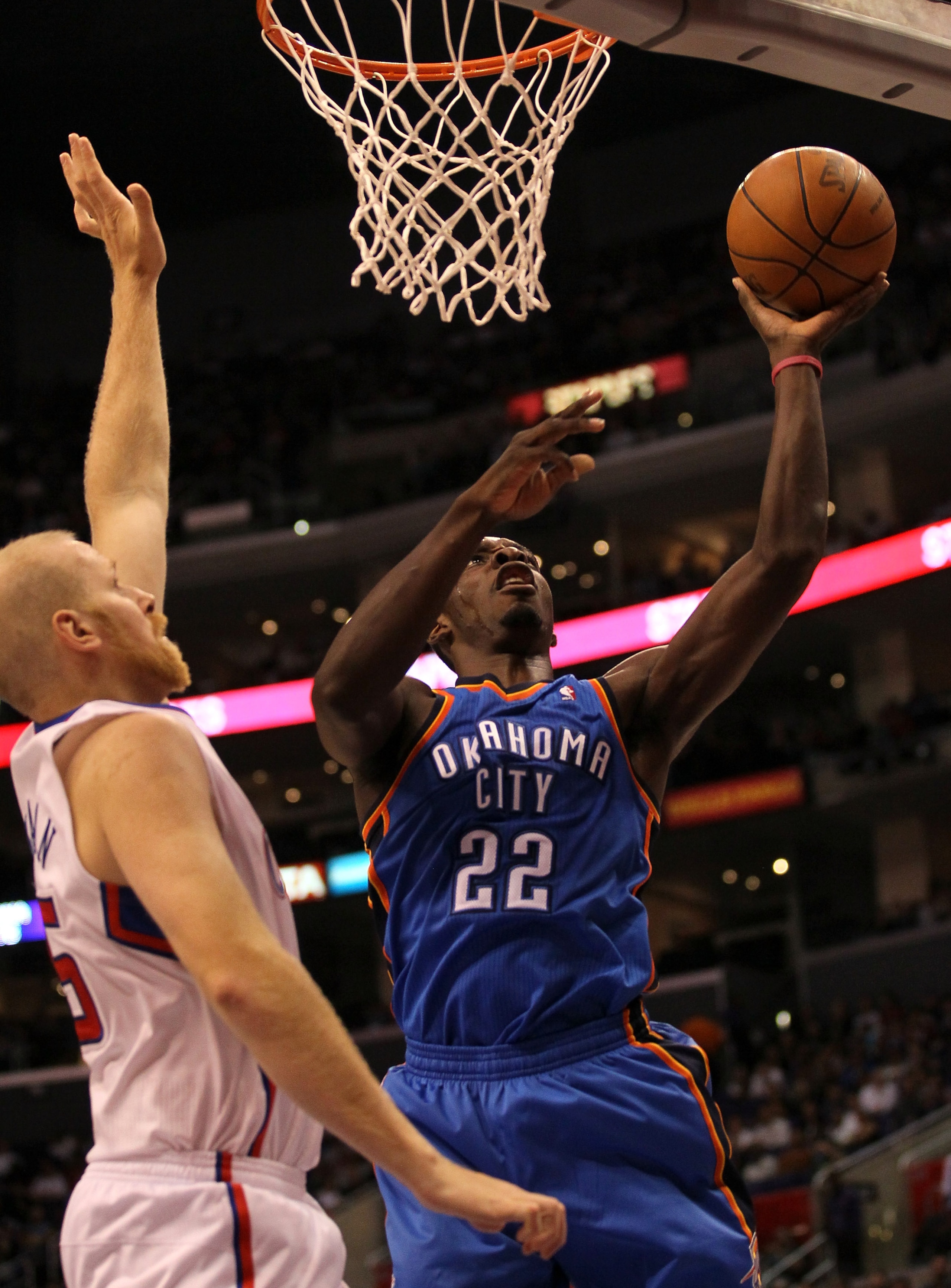LOS ANGELES - NOVEMBER 3:  Jeff Green #22 of the Oklahoma City Thunder shoots over Chris Kaman #35 of the Los Angeles Clippers at Staples Center on November 3, 2010 in Los Angeles, California.  NOTE TO USER: User expressly acknowledges and agrees that, by