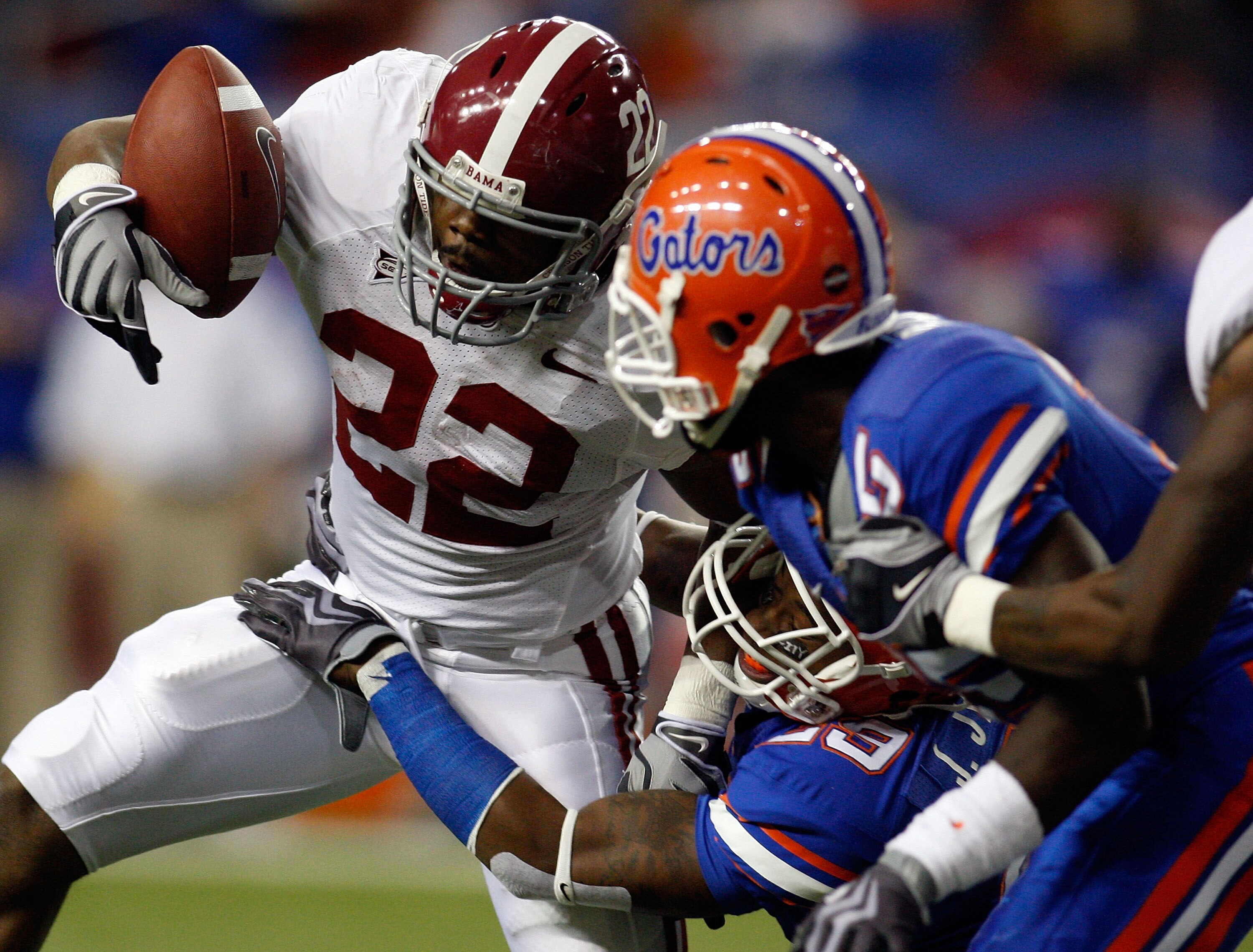 ATLANTA - DECEMBER 06:  Mark Ingram #22 of the Alabama Crimson Tide is brought down by Janoris Jenkins #29 of the Florida Gators during the SEC Championship on December 6, 2008 at the Georgia Dome in Atlanta, Georgia.  (Photo by Chris Graythen/Getty Image