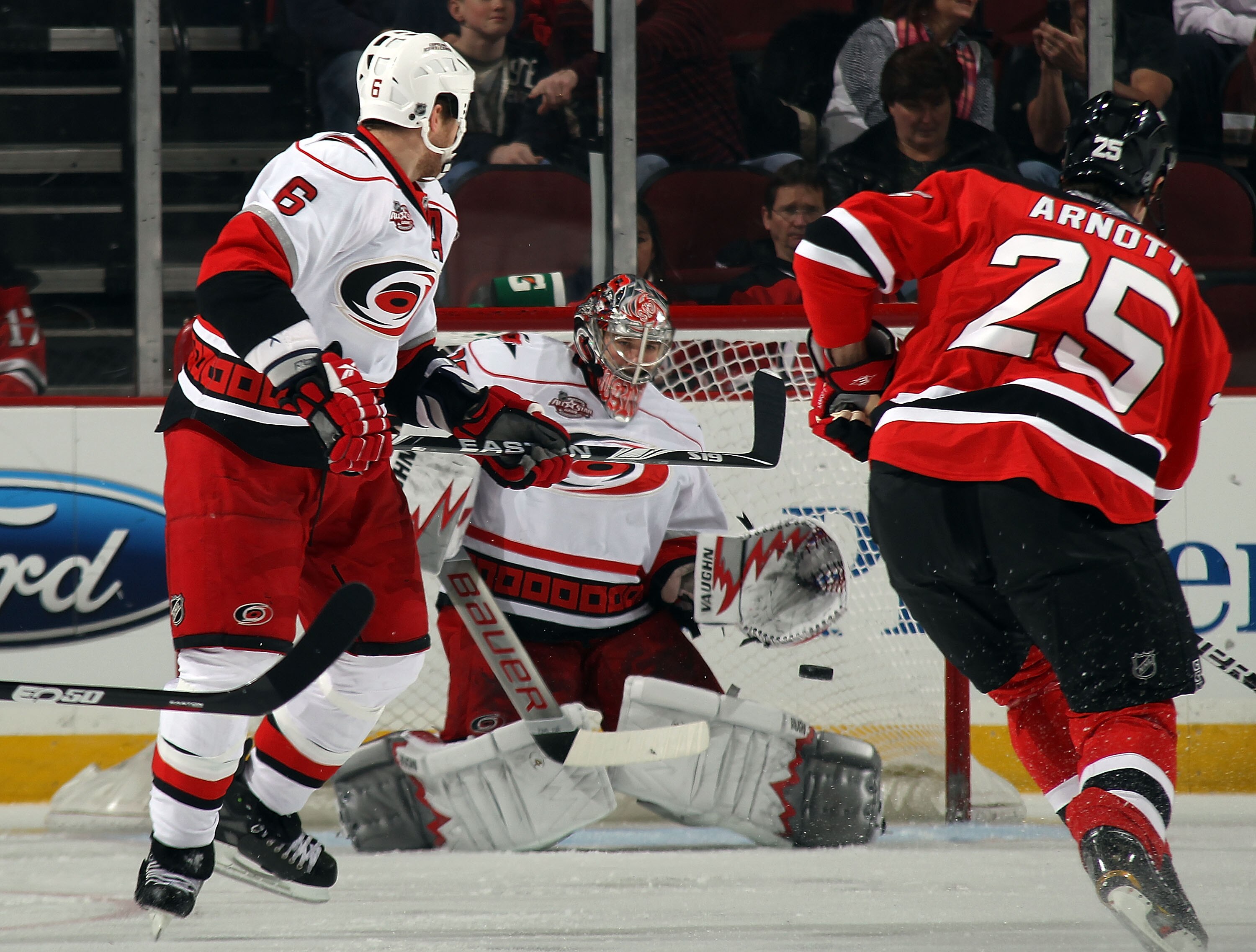NEWARK, NJ - FEBRUARY 16: Cam Ward #30 of the Carolina Hurricanes makes the save on Jason Arnott #25 of the New Jersey Devils during first period action at the Prudential Center on February 16, 2011 in Newark, New Jersey.  (Photo by Bruce Bennett/Getty Im