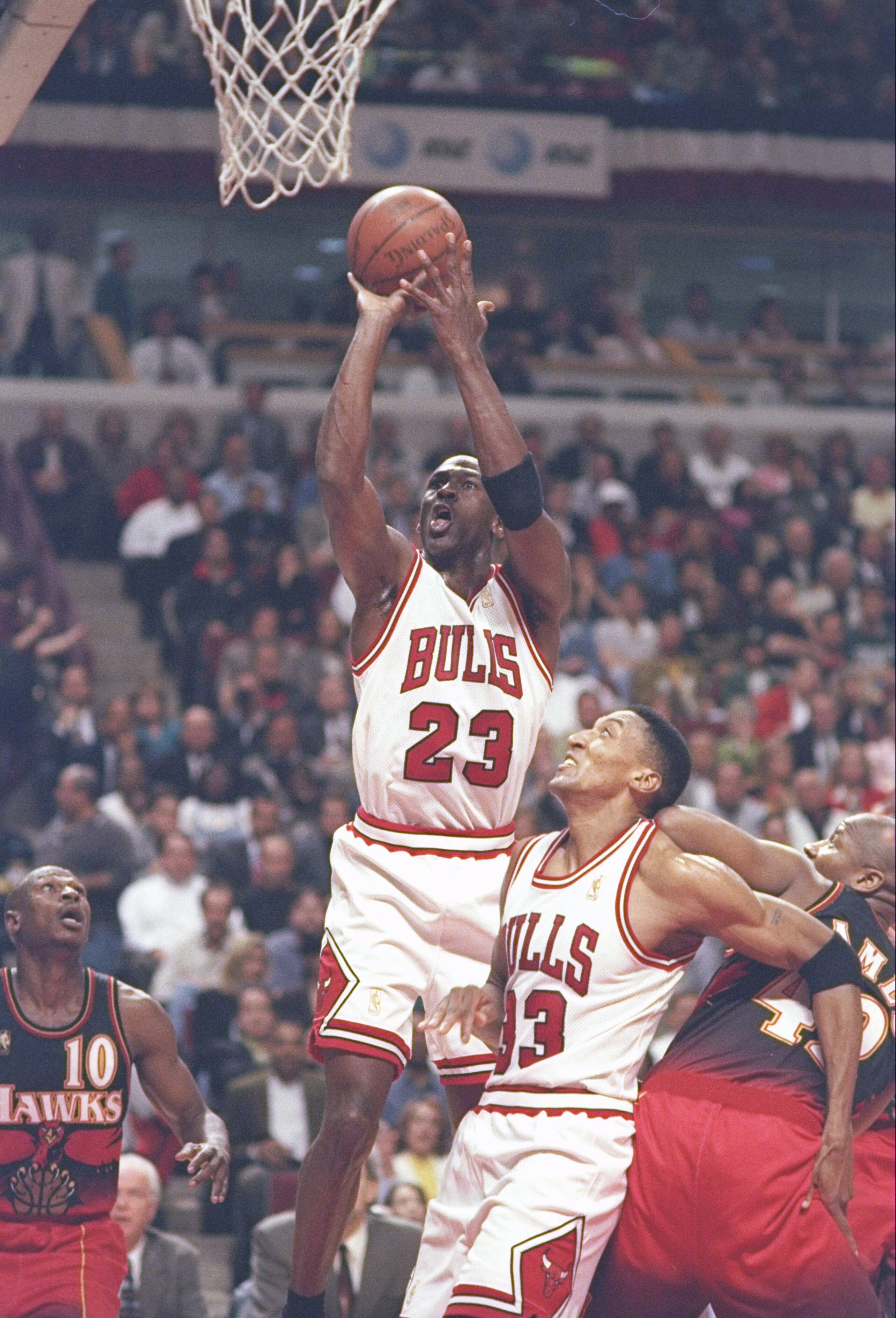 8 May 1997:  Guard Michael Jordan of the Chicago Bulls shoots the ball as Henry James and guard Mookie Blaylock of the Atlanta Hawks and forward Scottie Pippen of the Bulls watch during a playoff game at the United Center in Chicago, Illinois.  The Hawks