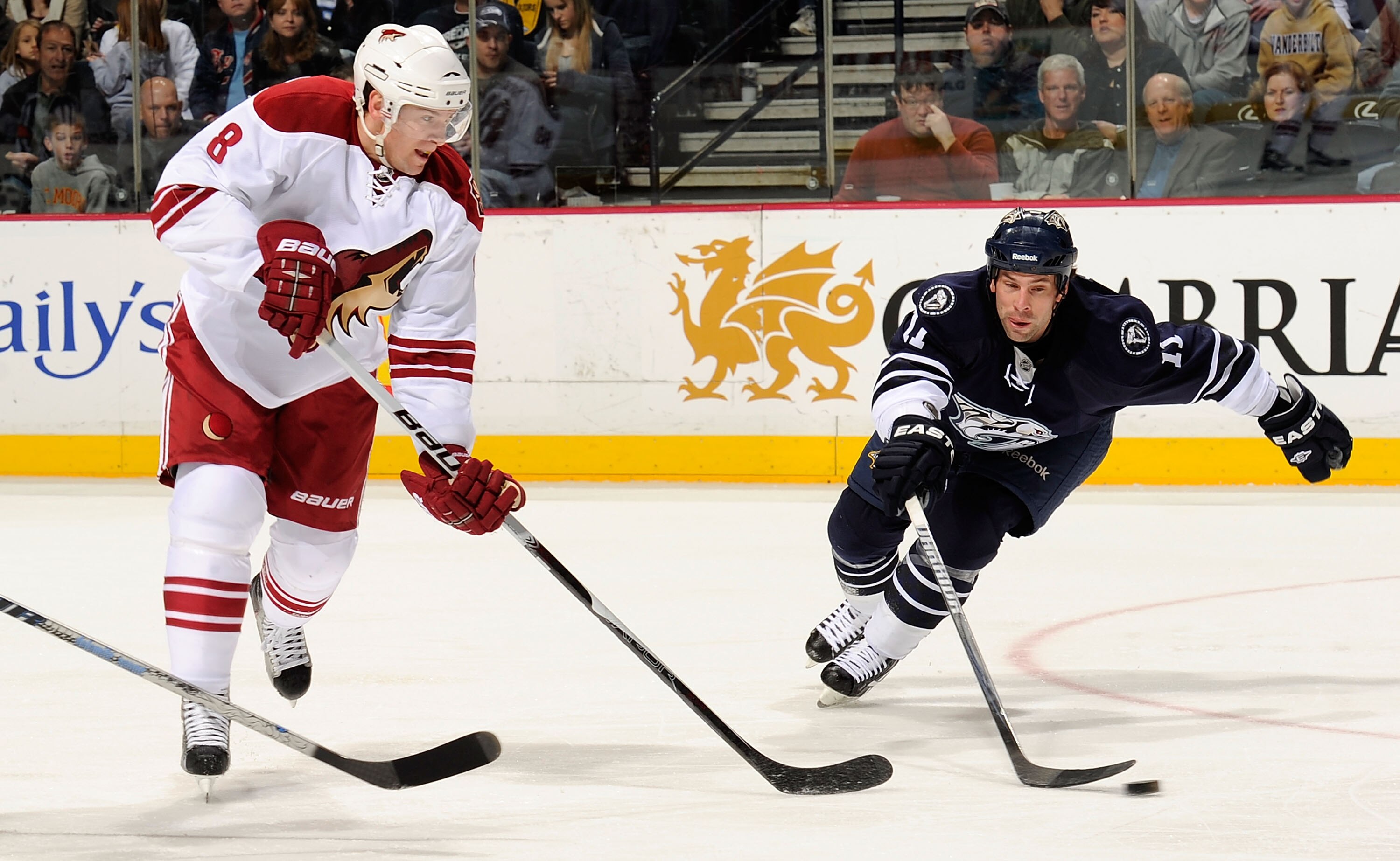 NASHVILLE, TN - FEBRUARY 19:  Scottie Upshall #8 of the Phoenix Coyotes skates against David Legwand #11 of the Nashville Predators on February 19, 2011 at the Bridgestone Arena in Nashville, Tennessee.  (Photo by Frederick Breedon/Getty Images)