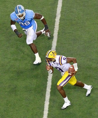 ATLANTA - SEPTEMBER 04:  Quarterback Jordan Jefferson #9 of the LSU Tigers against Donte Paige-Moss #98 of the North Carolina Tar Heels during the Chick-fil-A Kickoff Game at Georgia Dome on September 4, 2010 in Atlanta, Georgia.  (Photo by Kevin C. Cox/G