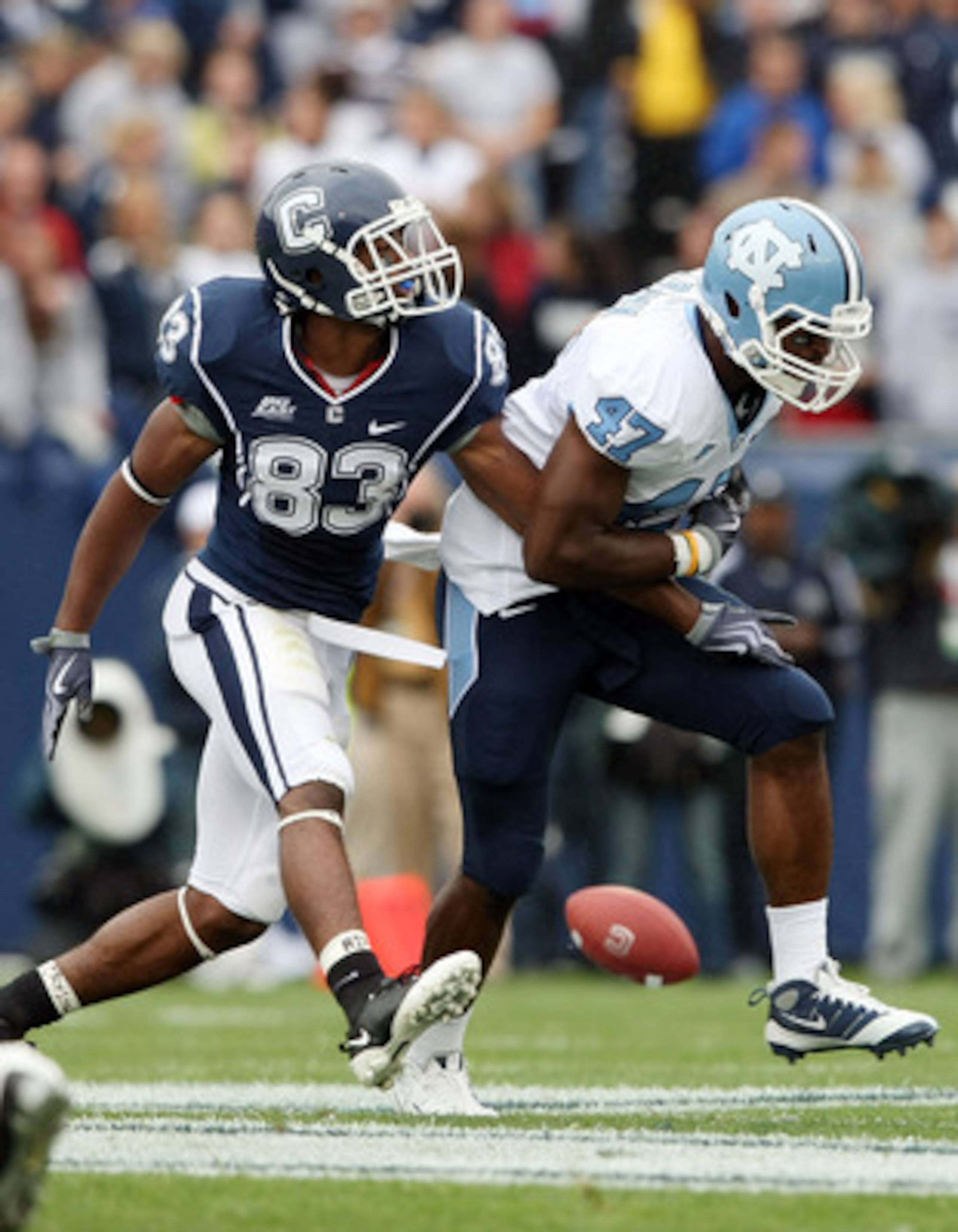EAST HARTFORD, CT - SEPTEMBER 12:  Zach Brown #47 of the North Carolinia Tar Heels breaks up a pass intended for Isiah Moore #83 of the Connecticut Huskies on September 12, 2009 at Rentschler Field in East Hartford, Connecticut.  (Photo by Elsa/Getty Imag