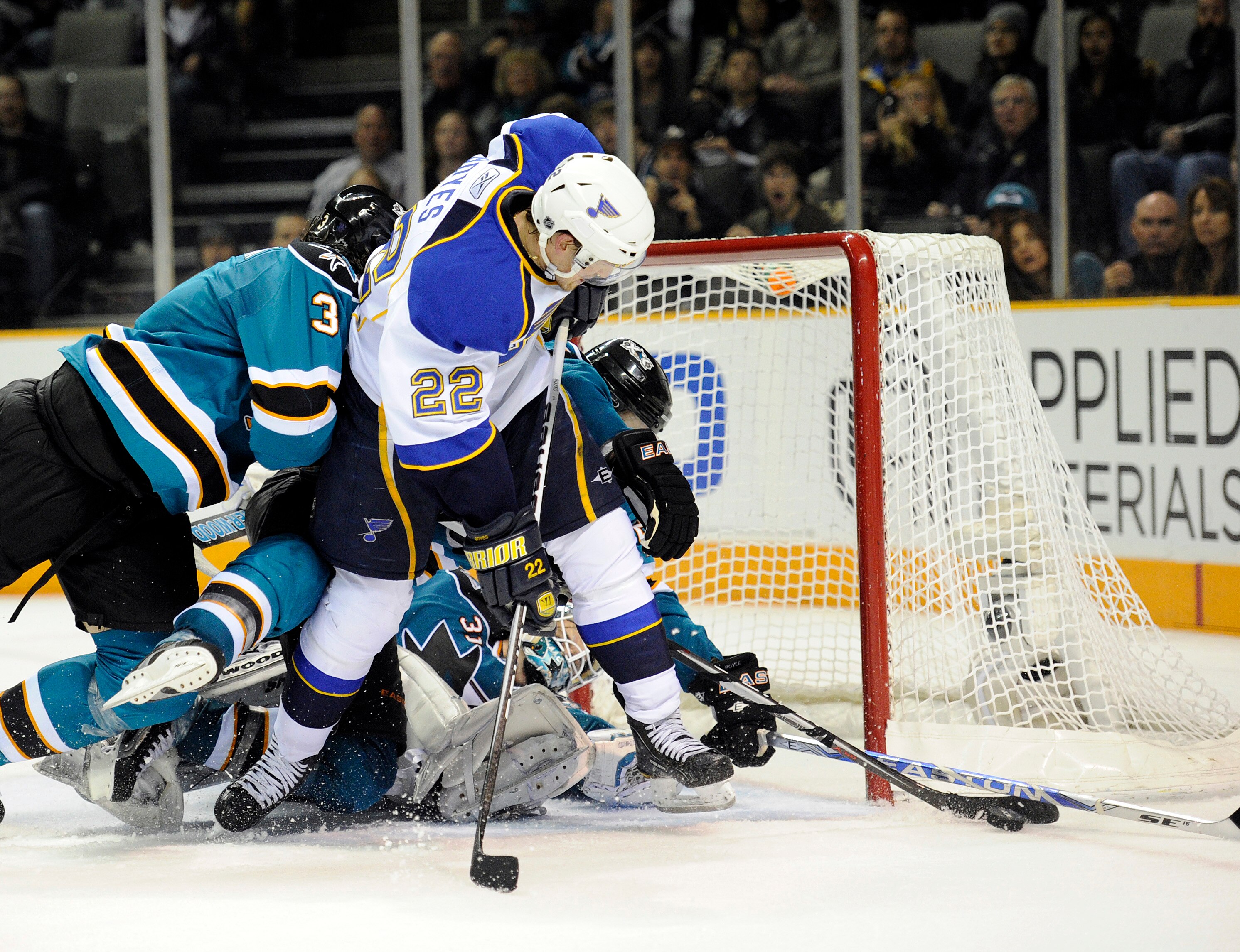 SAN JOSE, CA - JANUARY 15:  Brad Boyes #22 of the St. Louis Blues can't get his shot in the net pass the defense of the San Jose Sharks in the third period of an NHL hockey game at the HP Pavilion on January 15, 2011 in San Jose, California. The Sharks wo