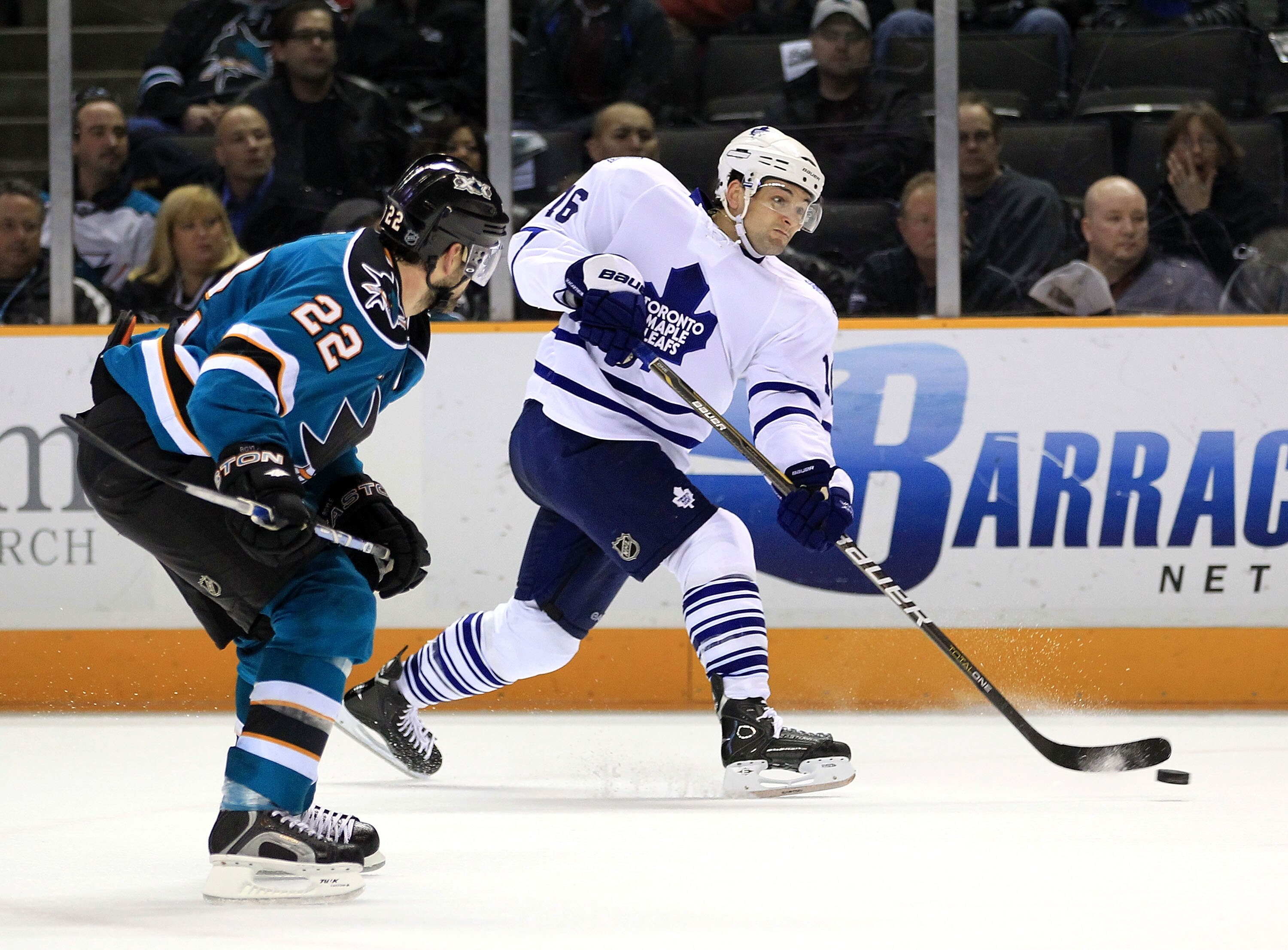 SAN JOSE, CA - JANUARY 11:  Clarke MacArthur #16 of the Toronto Maple Leafs takes a shot on goal in front of Dan Boyle #22 of the San Jose Sharks at HP Pavilion on January 11, 2011 in San Jose, California.  (Photo by Ezra Shaw/Getty Images)