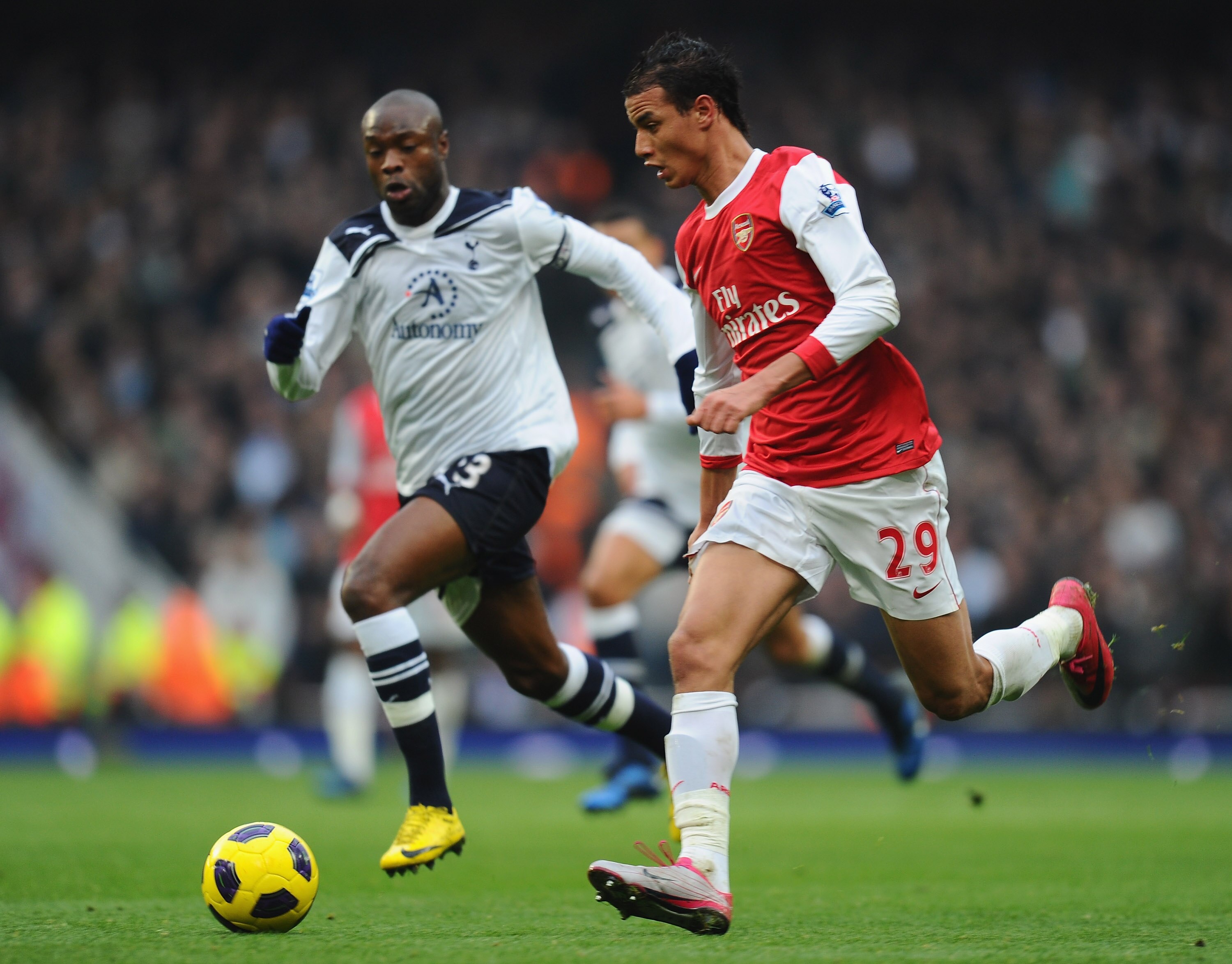 LONDON, ENGLAND - NOVEMBER 20:  Marouane Chamakh of Arsenal gets away from William Gallas of Tottenham during the Barclays Premier League match between Arsenal and Tottenham Hotspur at the Emirates Stadium on November 20, 2010 in London, England.  (Photo