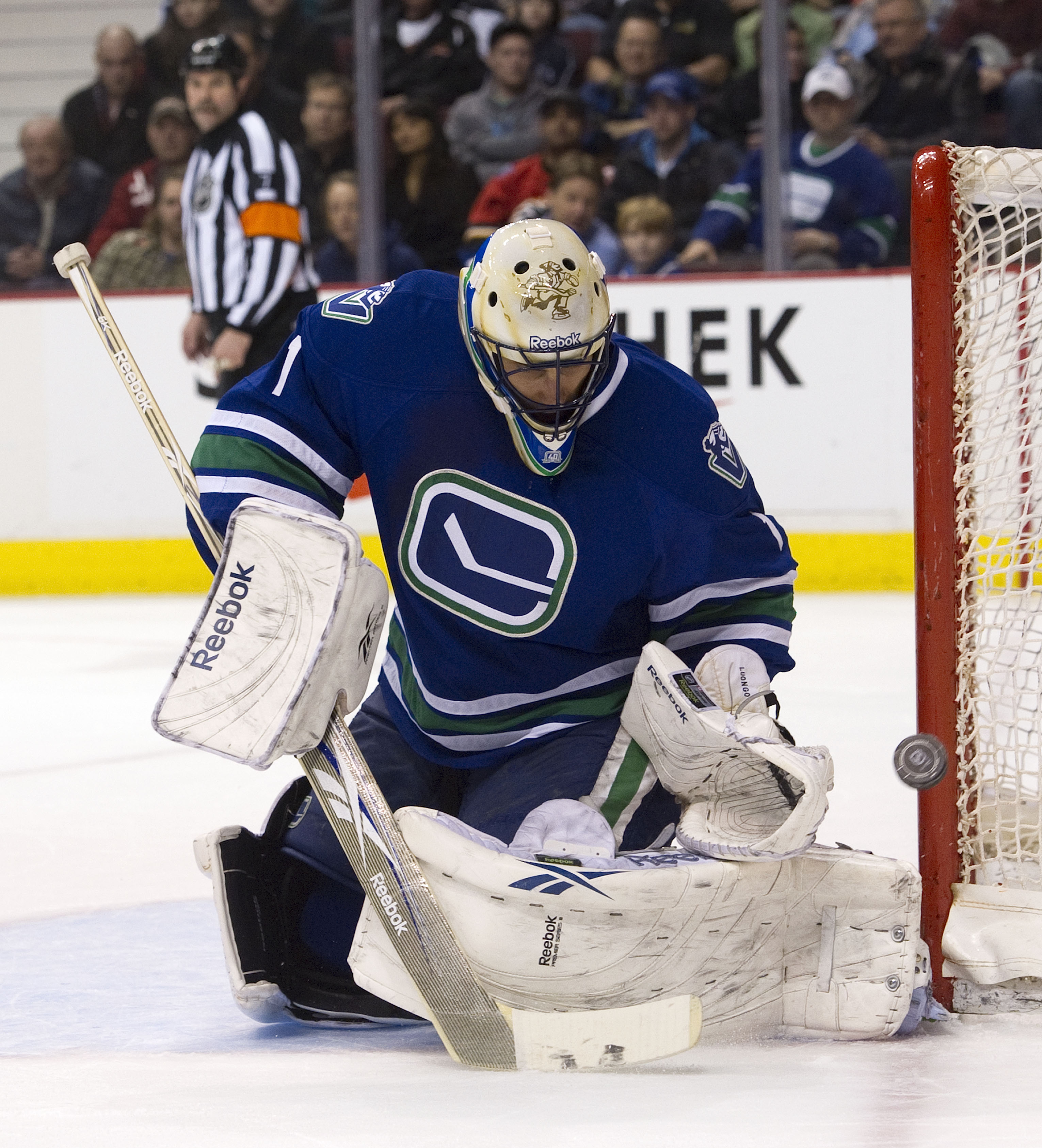 VANCOUVER, CANADA - FEBRUARY 12: Goalie Roberto Luongo #1 of the Vancouver Canucks makes a save against the Calgary Flames during the first period in NHL action on February 12, 2011 at Rogers Arena in Vancouver, British Columbia, Canada.  (Photo by Rich L