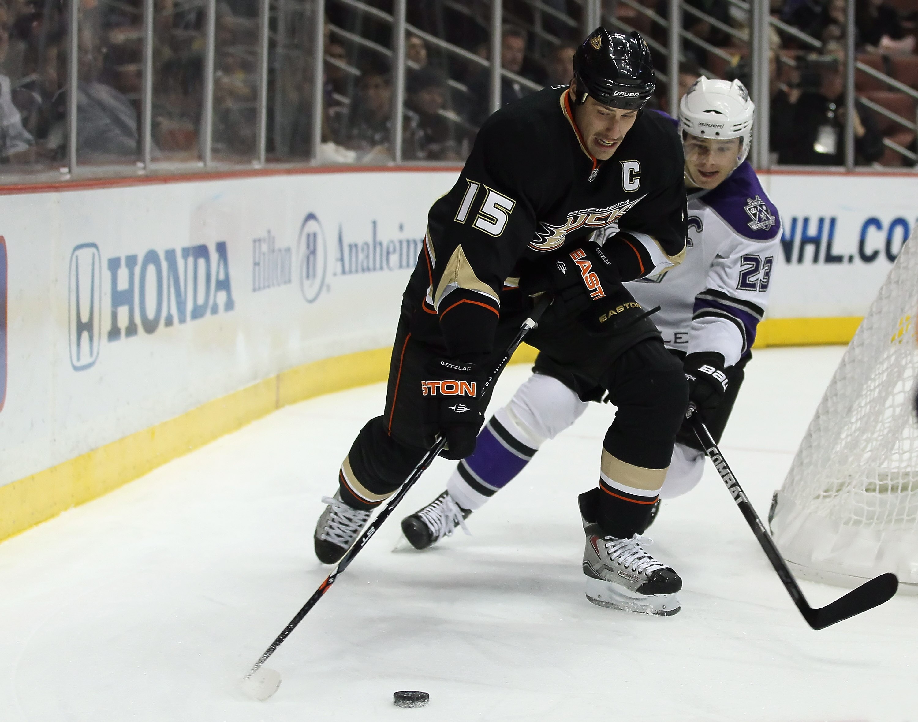 ANAHEIM, CA - NOVEMBER 29:  Ryan Getzlaf #15 of the Anaheim Ducks and Dustin Brown #23 of the Los Angeles Kings battle for the puck at the Honda Center on November 29, 2010 in Anaheim, California.  (Photo by Jeff Gross/Getty Images)