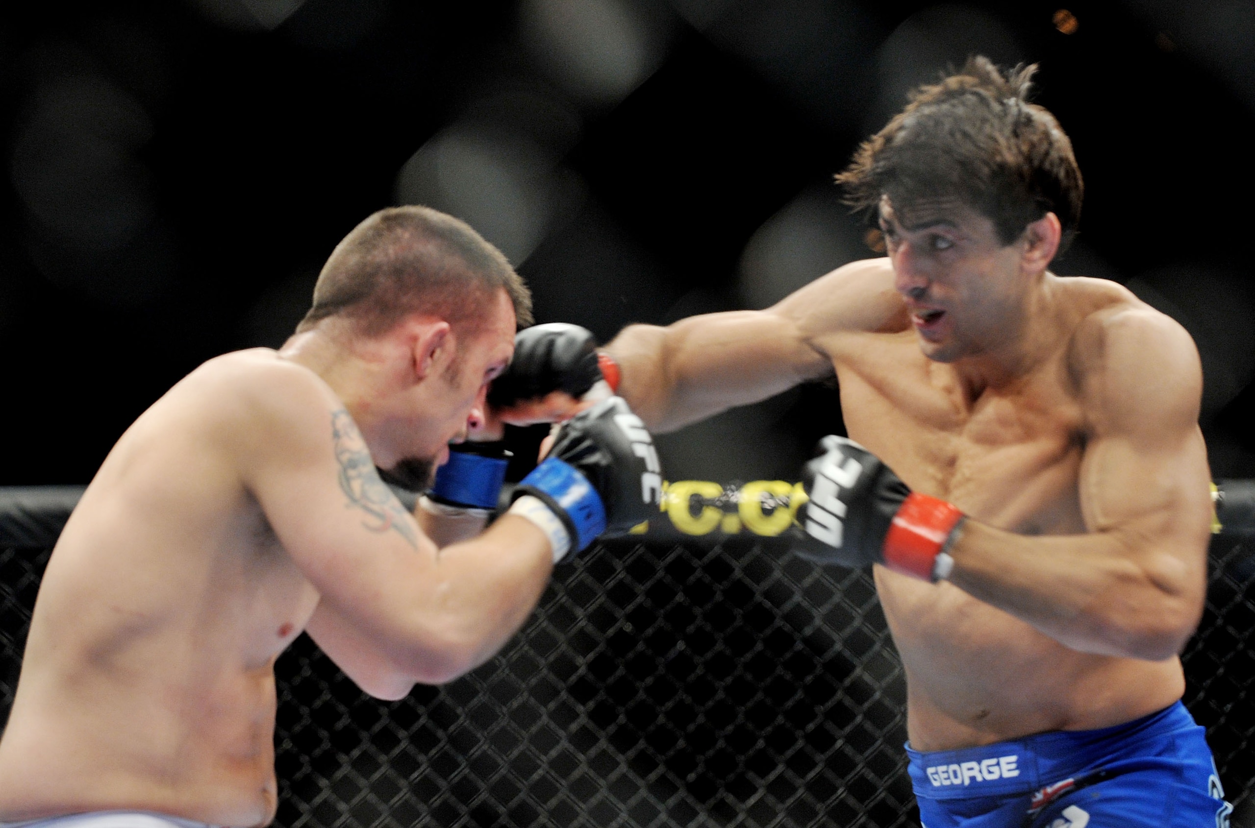 LAS VEGAS - NOVEMBER 21: Jason Dent (L) battles George Sotiropoulos (R) during their Lightweight Fight at the UFC 106 at Mandalay Bay Events Center on November 21, 2009 in Las Vegas, Nevada. (Photo by Jon Kopaloff/Getty Images)