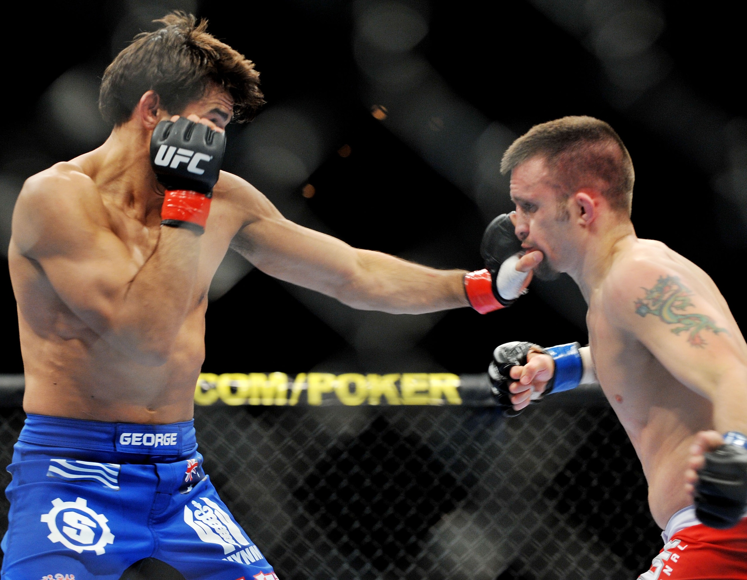 LAS VEGAS - NOVEMBER 21: George Sotiropoulos (L) battles Jason Dent (R) during their Lightweight Fight at the UFC 106 at Mandalay Bay Events Center on November 21, 2009 in Las Vegas, Nevada. (Photo by Jon Kopaloff/Getty Images)