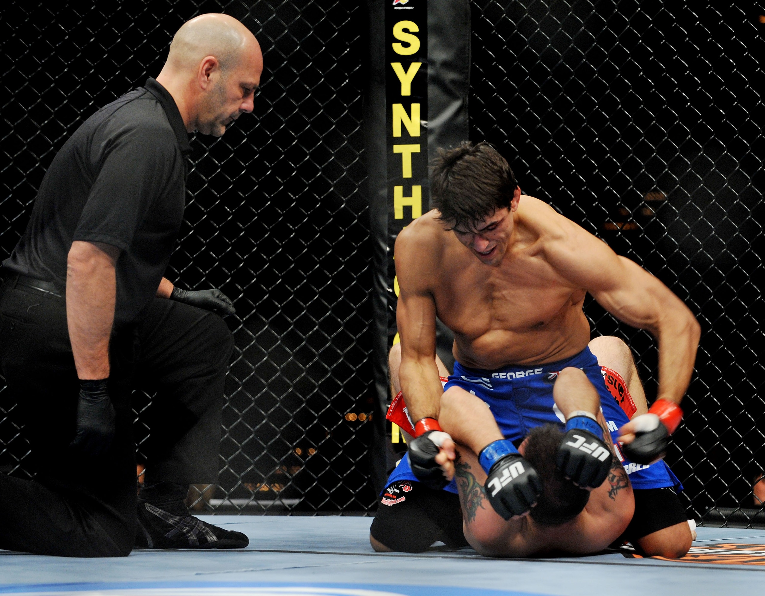 LAS VEGAS - NOVEMBER 21: George Sotiropoulos (Top) battles Jason Dent (Bottom) during their Lightweight Fight at the UFC 106 at Mandalay Bay Events Center on November 21, 2009 in Las Vegas, Nevada. (Photo by Jon Kopaloff/Getty Images)