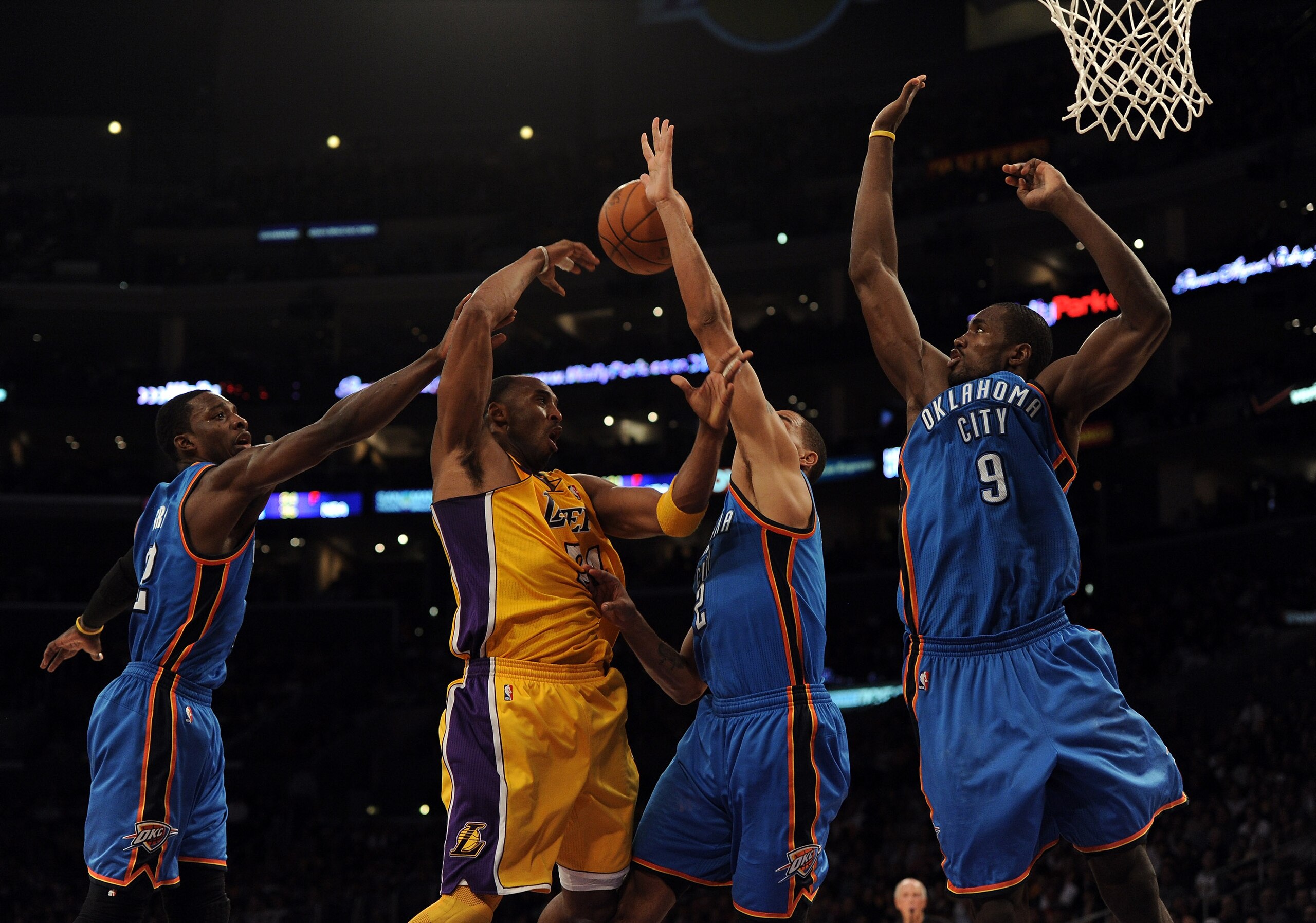 LOS ANGELES, CA - JANUARY 17: Kobe Bryant #24 of the Los Angeles Lakers makes a pass around Serge Ibaka #9,Thabo Sefolosha #2 and Jeff Green #22 of the Oklahoma City Thunder at the Staples Center on January 17, 2011 in Los Angeles, California. (Photo by LOS ANGELES, CA - JANUARY 17: Kobe Bryant #24 of the Los Angeles Lakers makes a pass around Serge Ibaka #9,Thabo Sefolosha #2 and Jeff Green #22 of the Oklahoma City Thunder at the Staples Center on January 17, 2011 in Los Angeles, California. (Photo by