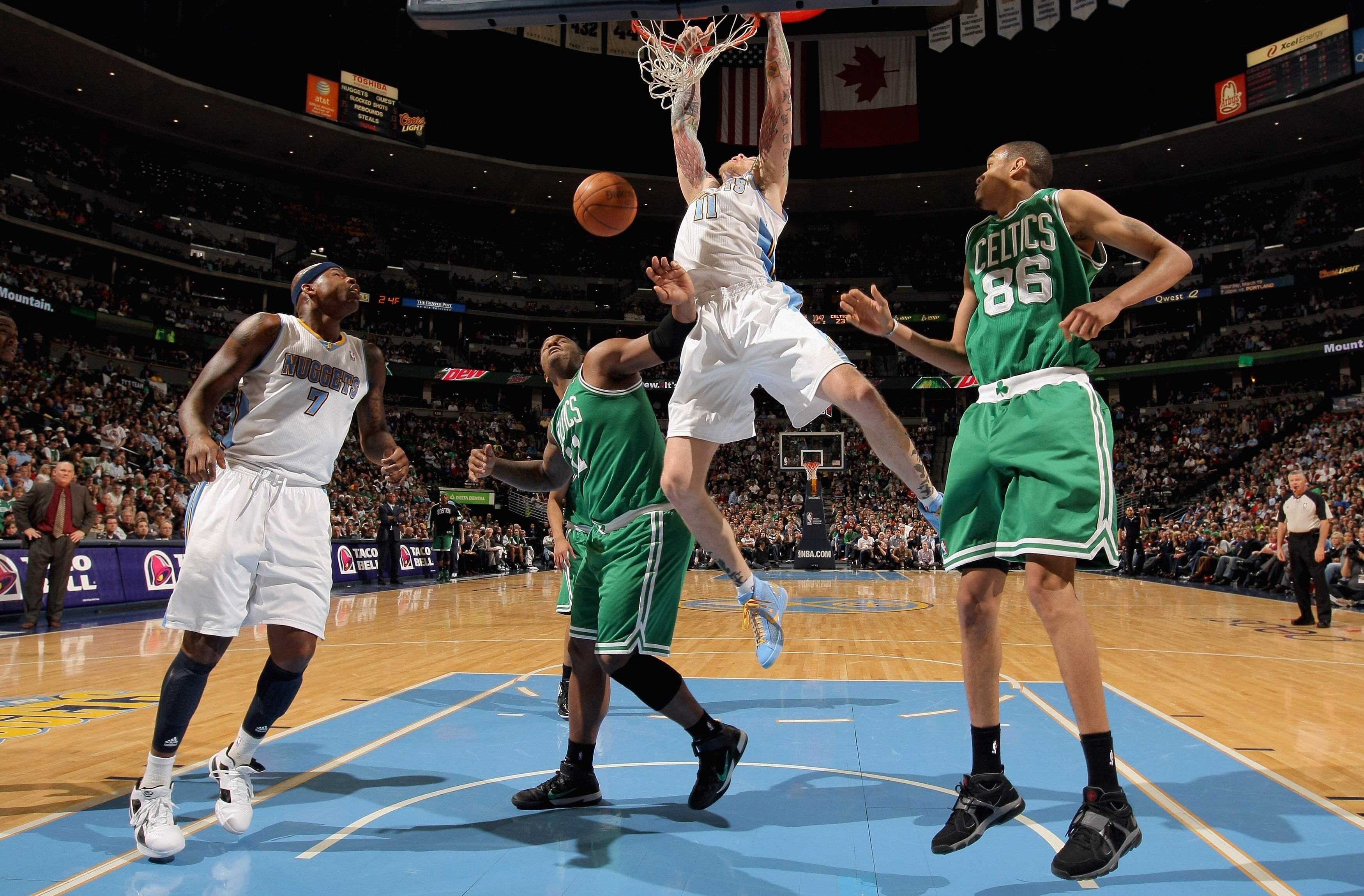 DENVER, CO - FEBRUARY 24:  Chris Andersen #11 of the Denver Nuggets dunks the ball against Glen Davis #11 and Chris Johnson #86 of the Boston Celtics during NBA action at the Pepsi Center on February 24, 2011 in Denver, Colorado. The Nuggets defeated the