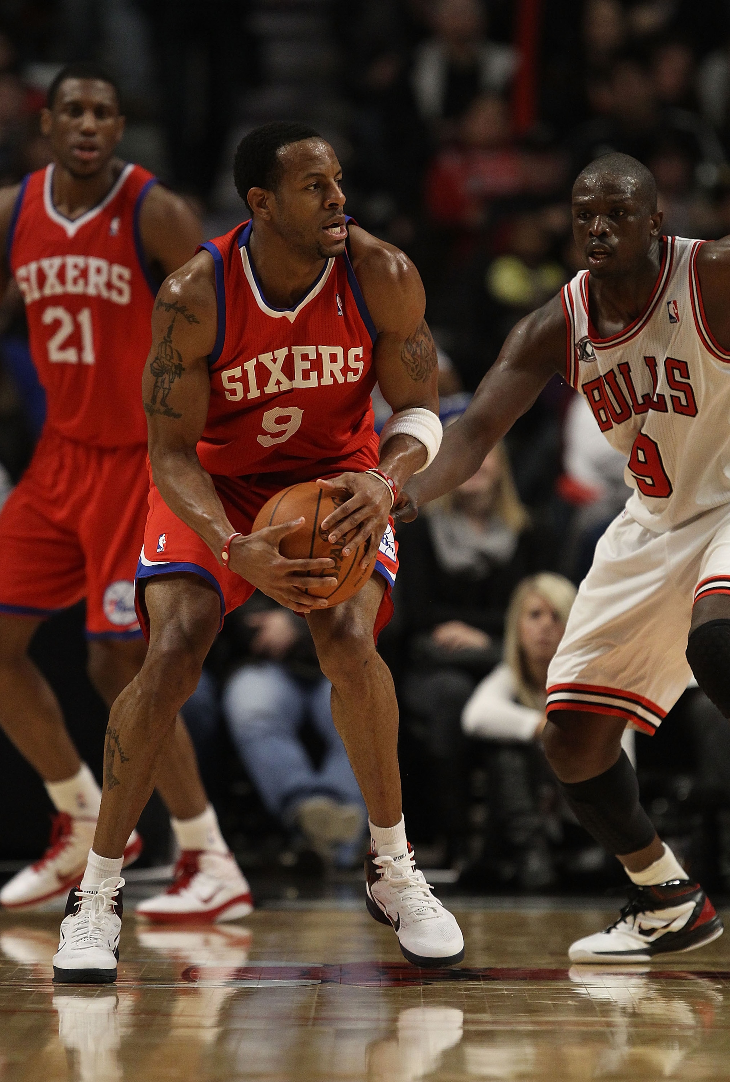 CHICAGO, IL - DECEMBER 21: Andre Iguodala #9 of the Philadelphia 76ers tries to move against Loul Deng #9 of the Chicago Bulls at the United Center on December 21, 2010 in Chicago, Illinois. The Bulls defeated the 76ers 121-76. NOTE TO USER: User expressl CHICAGO, IL - DECEMBER 21: Andre Iguodala #9 of the Philadelphia 76ers tries to move against Loul Deng #9 of the Chicago Bulls at the United Center on December 21, 2010 in Chicago, Illinois. The Bulls defeated the 76ers 121-76. NOTE TO USER: User expressl