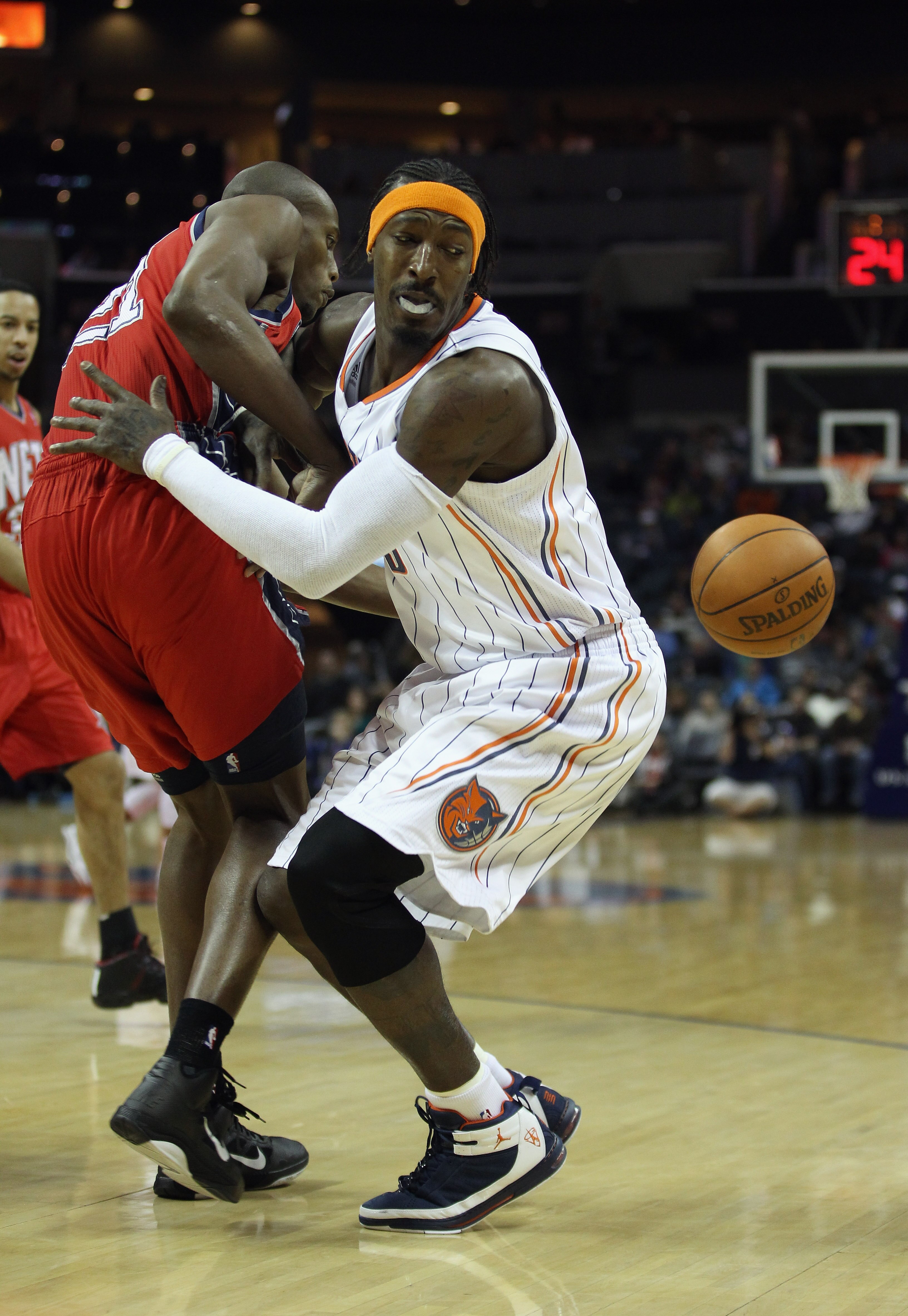 CHARLOTTE, NC - FEBRUARY 11: Travis Outlaw #21 of the New Jersey Nets collides with Gerald Wallace #3 of the Charlotte Bobcats during their game at Time Warner Cable Arena on February 11, 2011 in Charlotte, North Carolina. NOTE TO USER: User expressly ac CHARLOTTE, NC - FEBRUARY 11: Travis Outlaw #21 of the New Jersey Nets collides with Gerald Wallace #3 of the Charlotte Bobcats during their game at Time Warner Cable Arena on February 11, 2011 in Charlotte, North Carolina. NOTE TO USER: User expressly ac