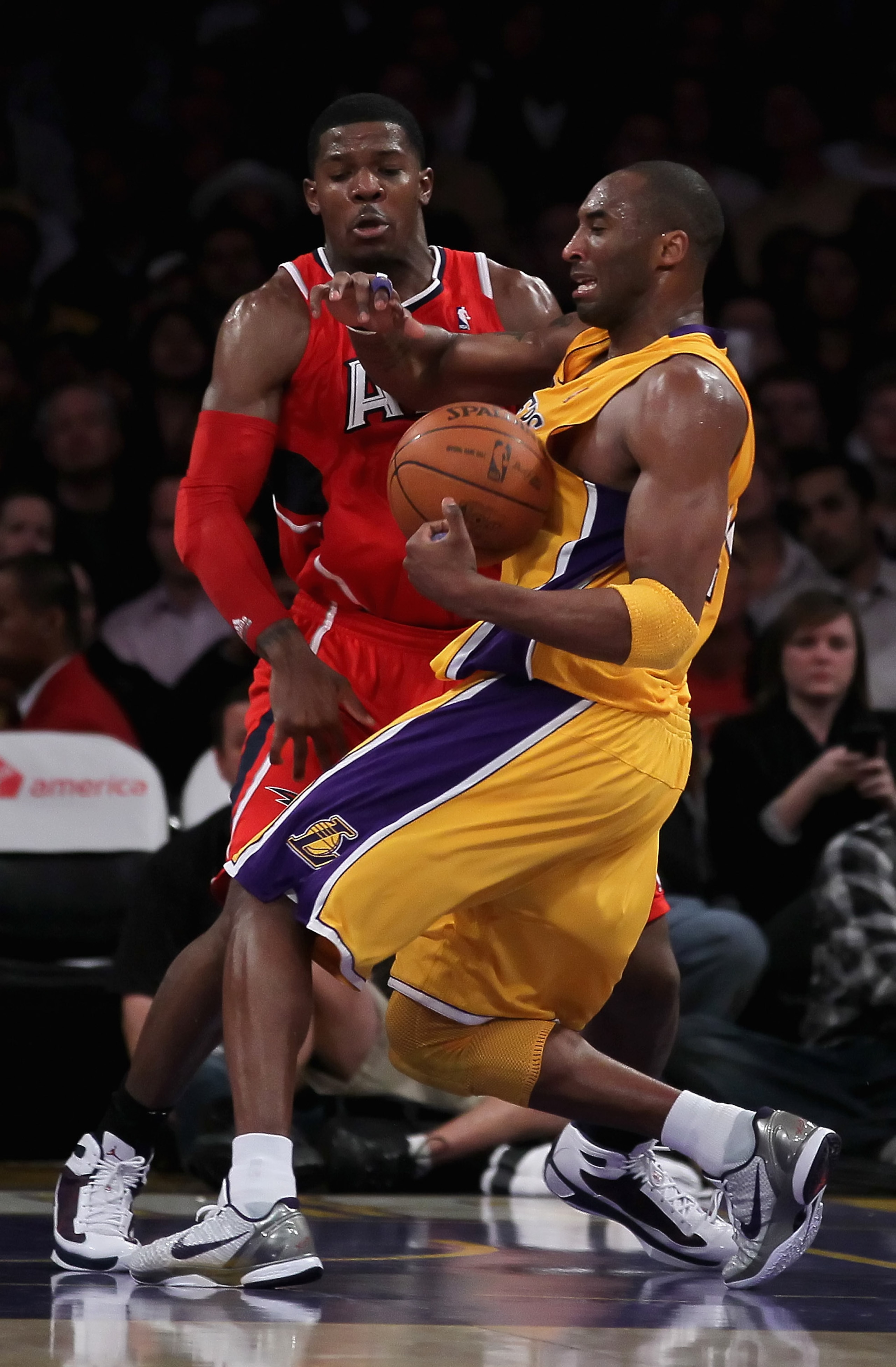 LOS ANGELES, CA - FEBRUARY 22:  Kobe Bryant #24 of the Los Angeles Lakers and Joe Johnson #2 of the Atlanta Hawks fight for the ball in the second half at Staples Center on February 22, 2011 in Los Angeles, California. The Lakers defeated the Hawks 104-80