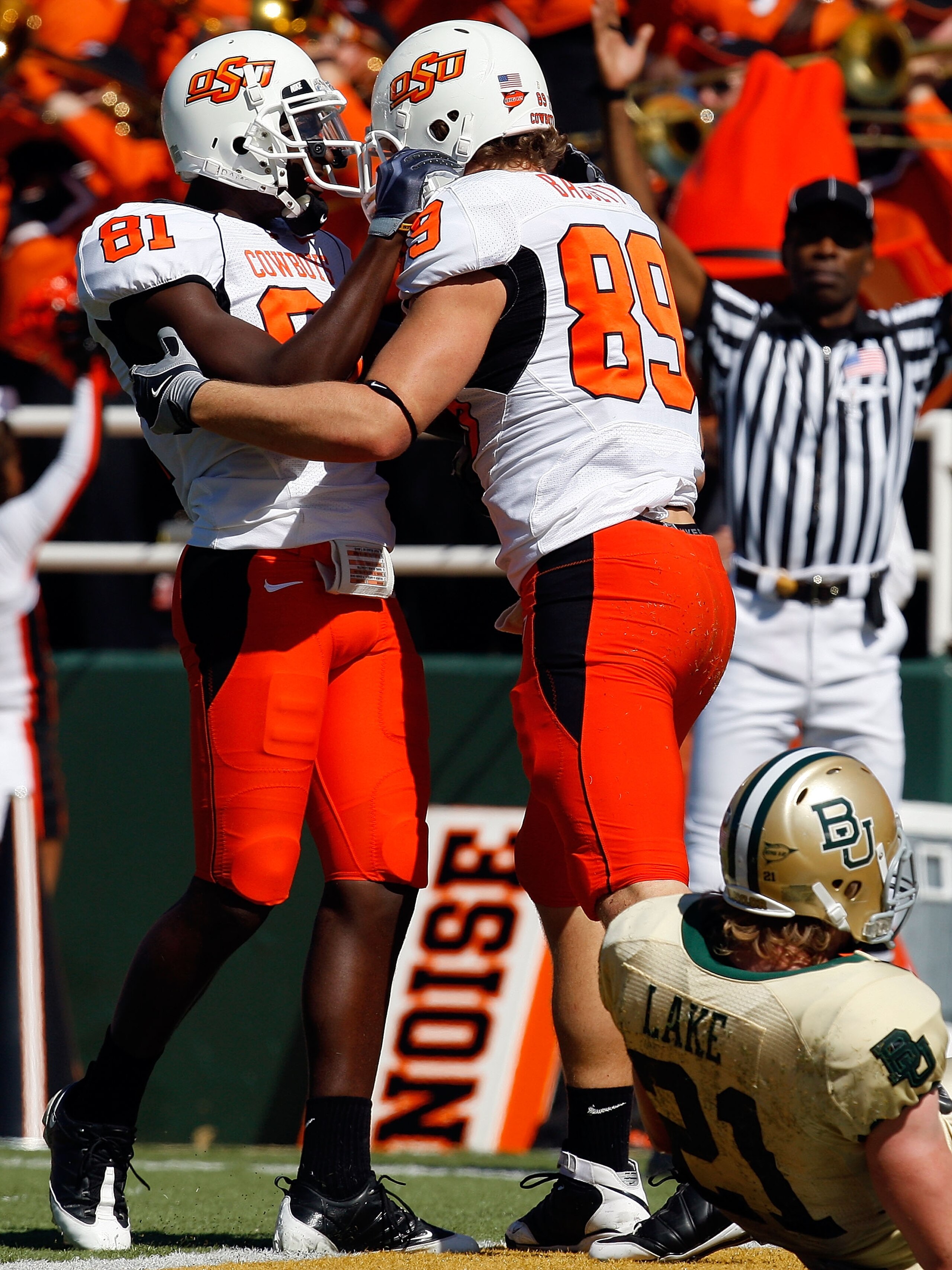 WACO, TX - OCTOBER 24: Justin Blackmon #81 and Cooper Nicholas #89 of the Oklahoma State Cowboys celebrate a touchdown in front of Jordan Lake #21 of the Baylor Bears at Floyd Casey Stadium on October 24, 2009 in Waco, Texas. (Photo by Ronald Martinez/G WACO, TX - OCTOBER 24: Justin Blackmon #81 and Cooper Nicholas #89 of the Oklahoma State Cowboys celebrate a touchdown in front of Jordan Lake #21 of the Baylor Bears at Floyd Casey Stadium on October 24, 2009 in Waco, Texas. (Photo by Ronald Martinez/G