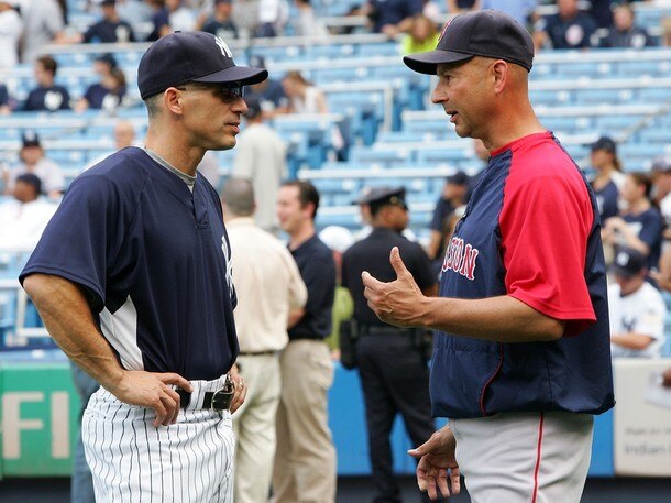 Joe Girardi talks to Terry Francona (courtesy of Getty Images)