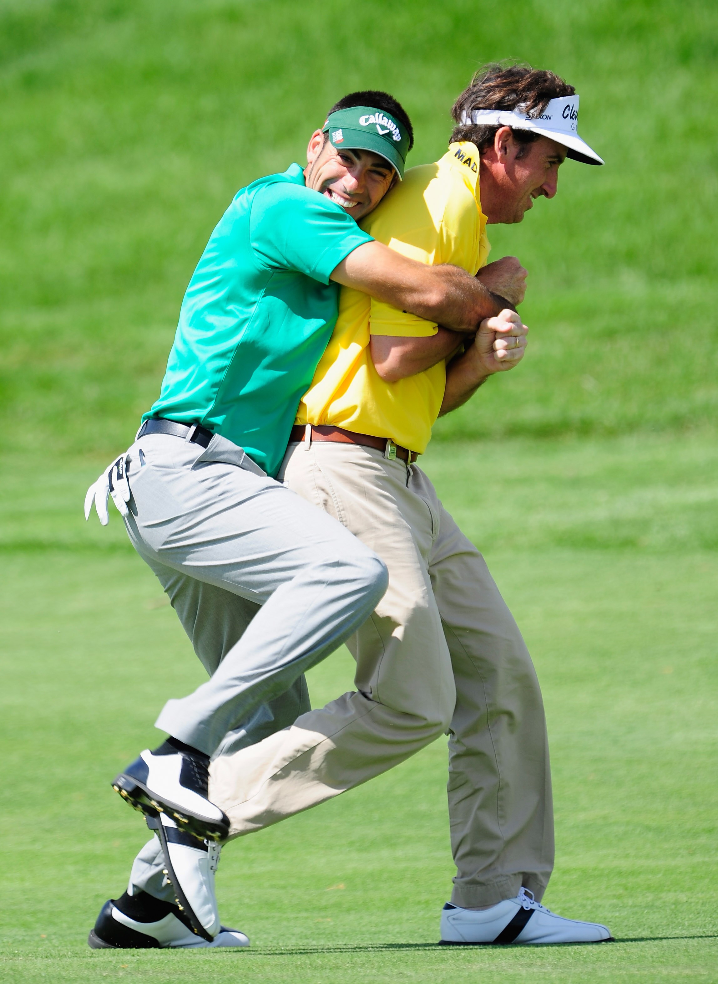 MADRID, SPAIN - MAY 28:  Alvaro Quiros holds onto playing partner and country man Gonzalo Fernandez - Castano of Spain during the second round of the Madrid Masters at Real Sociedad Hipica Espanola Club De Campo on May 28, 2010 in Madrid, Spain.  (Photo b