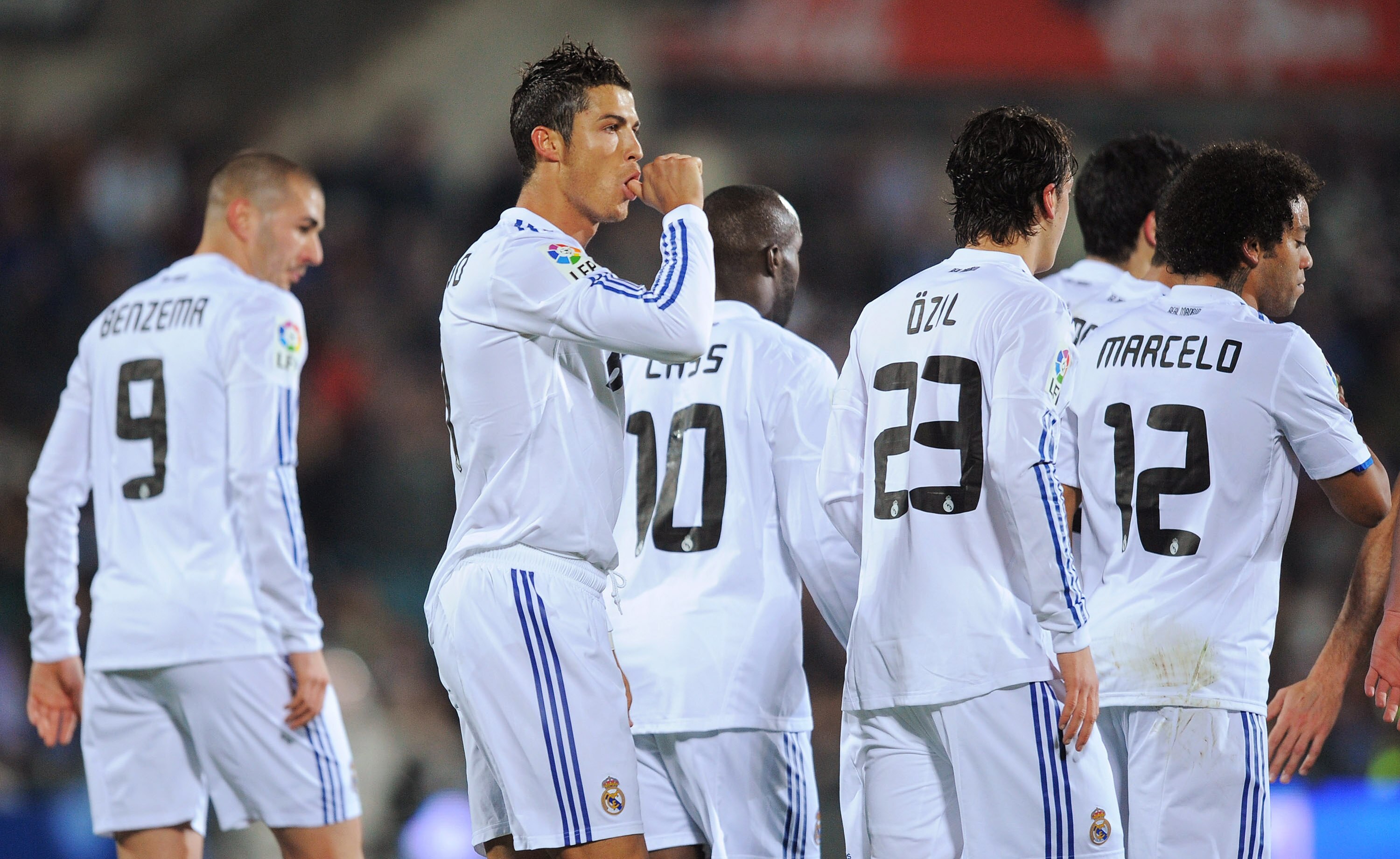 GETAFE, SPAIN - JANUARY 03:  Cristiano Ronaldo (2nd L) of Real Madrid celebrates after scoring Real's first goal from the penalty spot during the La Liga match between Getafe and Real Madrid at Coliseum Alfonso Perez stadium on January 3, 2011 in Getafe,