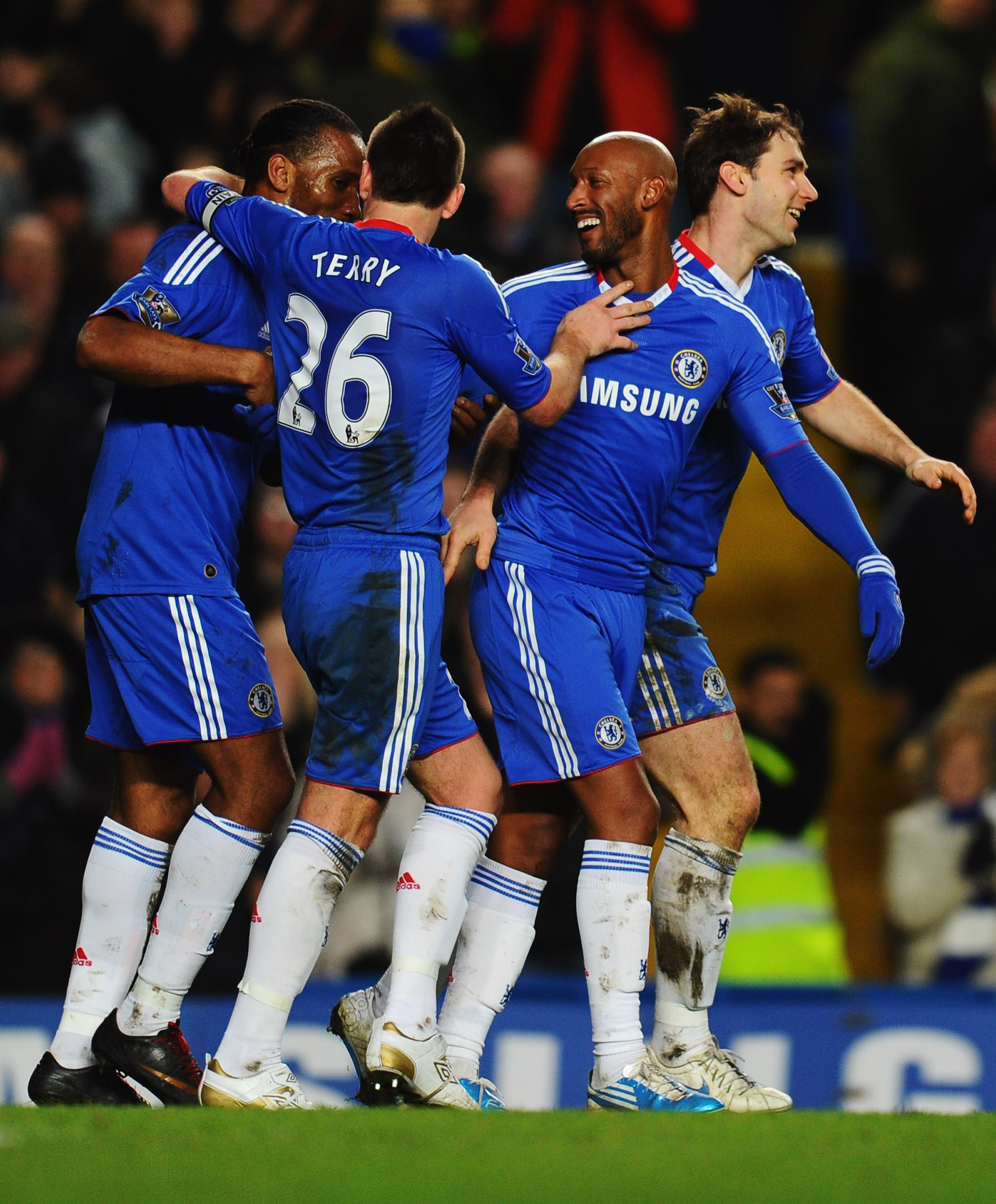 LONDON, ENGLAND - JANUARY 15:  Nicolas Anelka of Chelsea (2R) celebrates with Didier Drogba (L), John Terry (2L) and Branislav Ivanovic (R) as he scores their second goal during the Barclays Premier League match between Chelsea and Blackburn Rovers at Sta