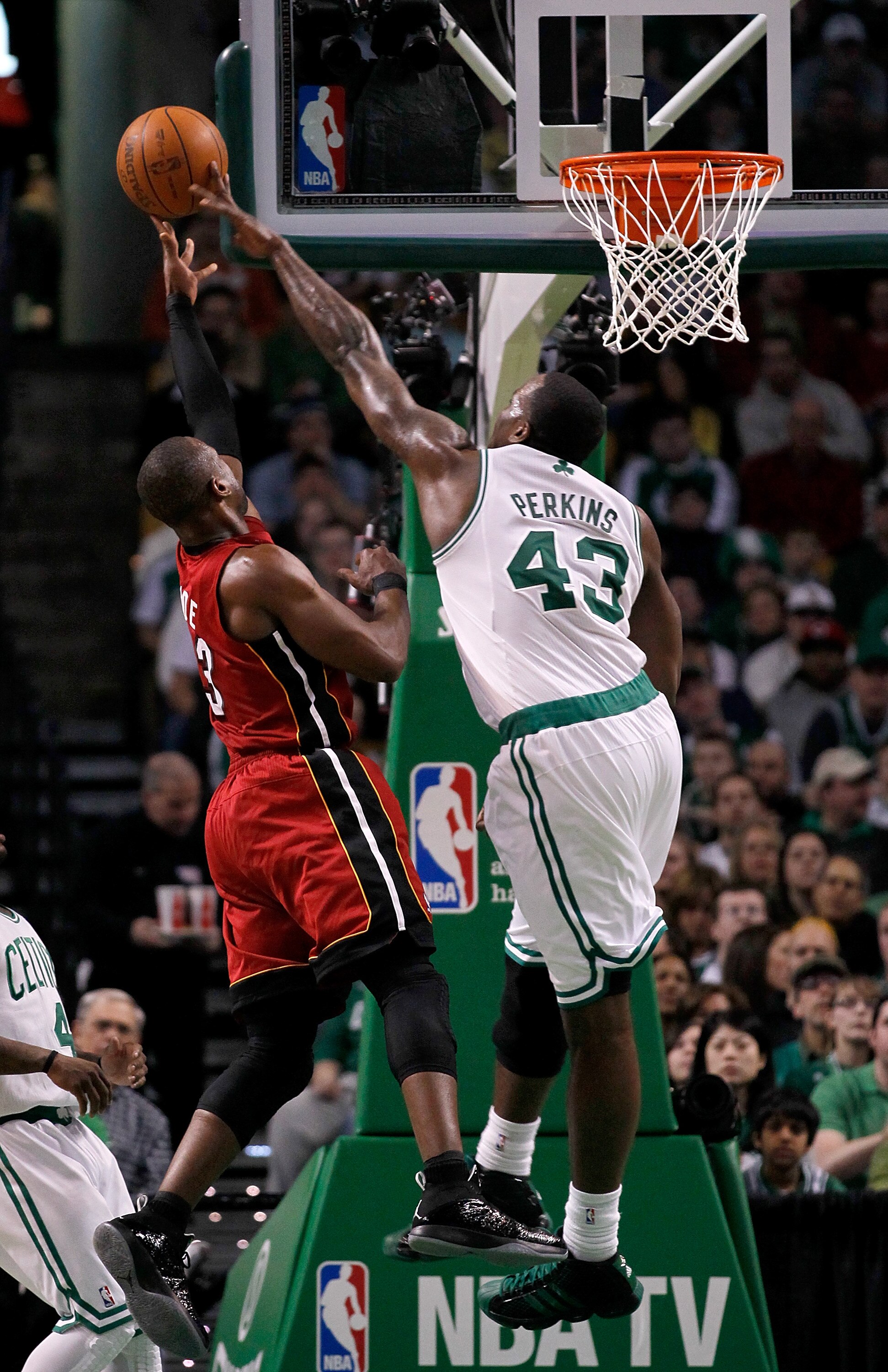 BOSTON - FEBRUARY 13:  Dwyane Wade #3 of the Miami Heat goes to the basket against Kendrick Perkins #43 of the Boston Celtics at TD Garden on February 13, 2011 in Boston, Massachusetts. NOTE TO USER: User expressly acknowledges and agrees that, by downloa