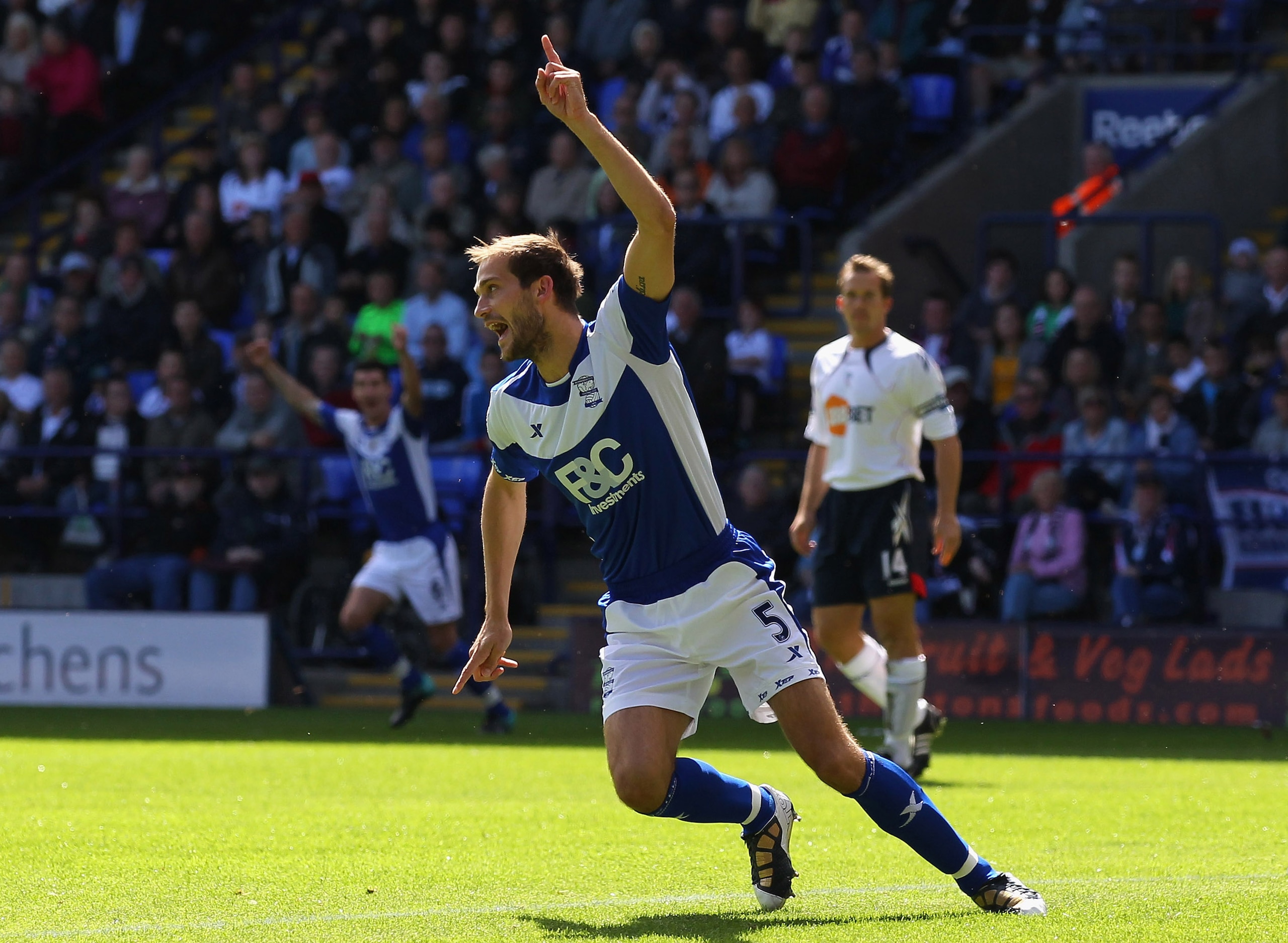 BOLTON, ENGLAND - AUGUST 29:  Roger Johnson of Birmingham City turns to celebrate after scoring the opening goal during the Barclays Premier League match between Bolton Wanderers and Birmingham City at Reebok Stadium on August 29, 2010 in Bolton, England.