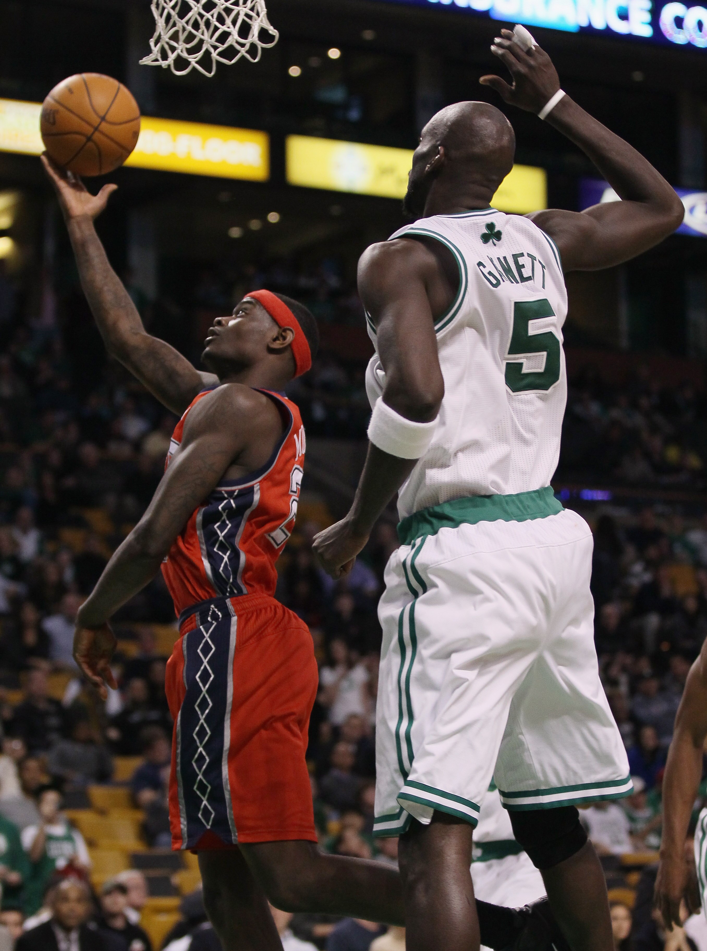 BOSTON - NOVEMBER 24:  Anthony Morrow #22 of the New Jersey Nets takes a shot as Kevin Garnett #5 of the Boston Celtics defends on November 24, 2010 at the TD Garden in Boston, Massachusetts. The Celtics defeated the nets 89-83. NOTE TO USER: User express