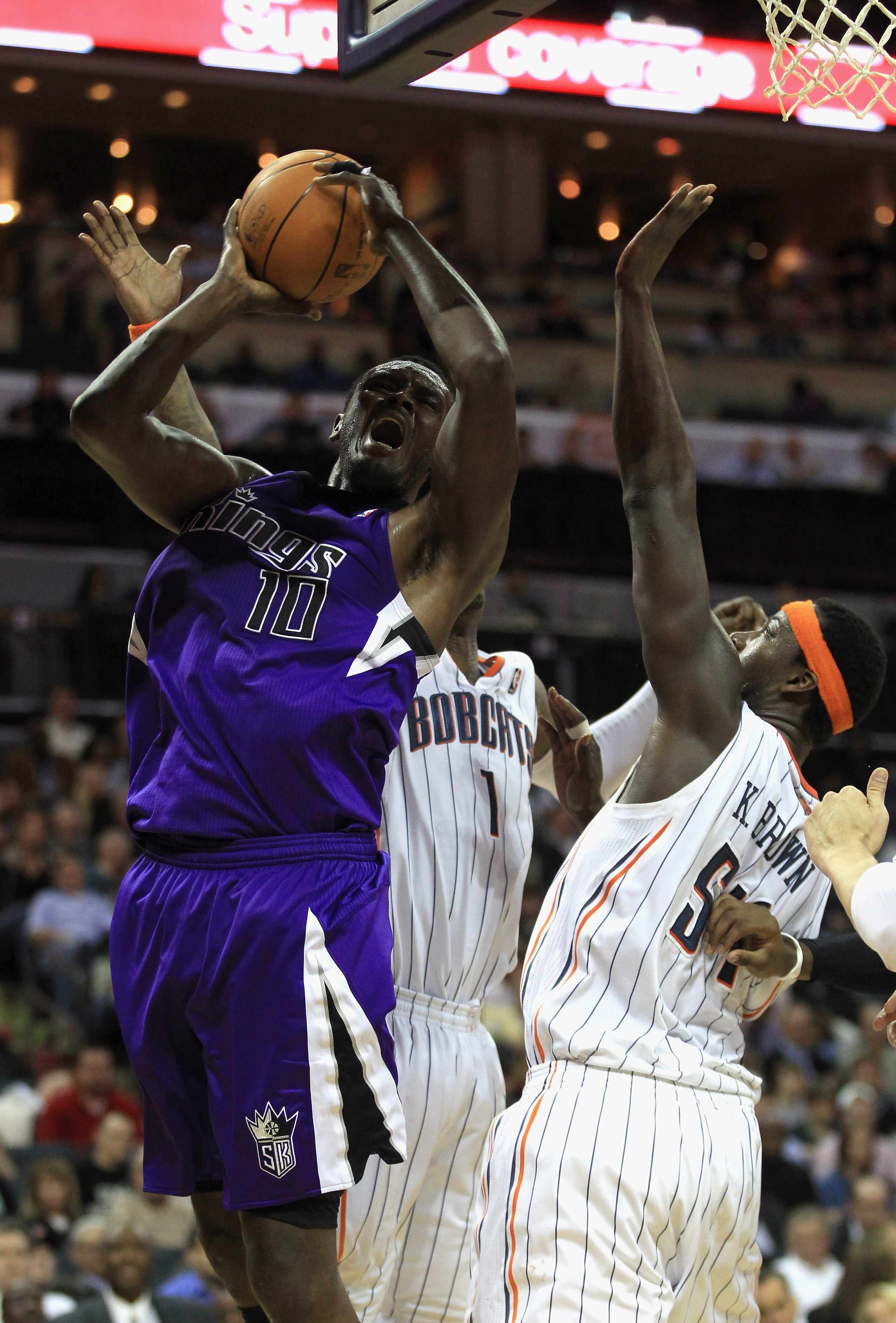 CHARLOTTE, NC - FEBRUARY 25:  Samuel Dalembert #10 of the Sacramento Kings shoots the ball over Kwame Brown #54 of the Charlotte Bobcats during their game at Time Warner Cable Arena on February 25, 2011 in Charlotte, North Carolina. NOTE TO USER: User exp