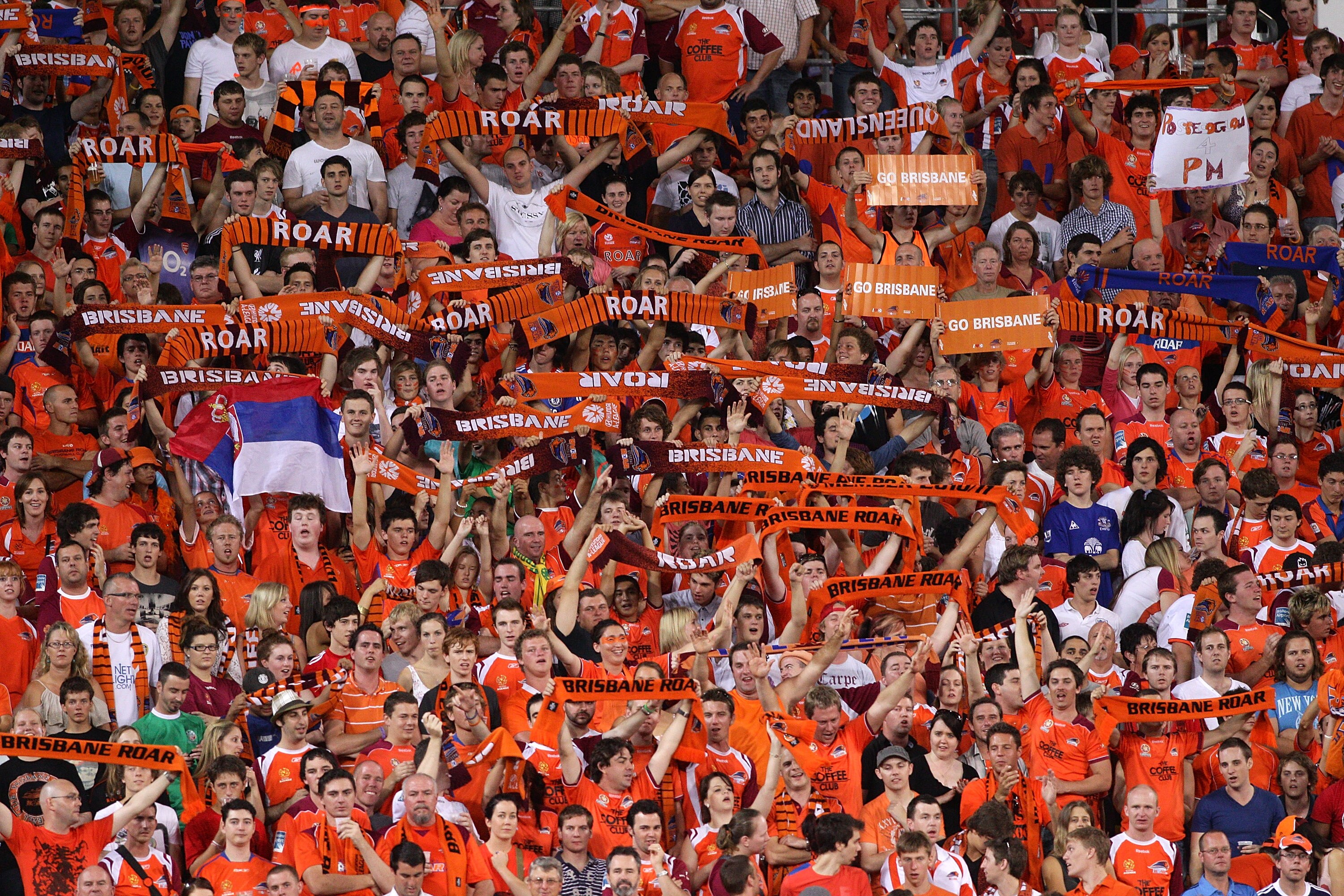 BRISBANE, AUSTRALIA - FEBRUARY 26:  Roar fans show their colours during the A-League major semi final match between the Brisbane Roar and the Central Coast Mariners at Suncorp Stadium on February 26, 2011 in Brisbane, Australia.  (Photo by Bradley Kanaris