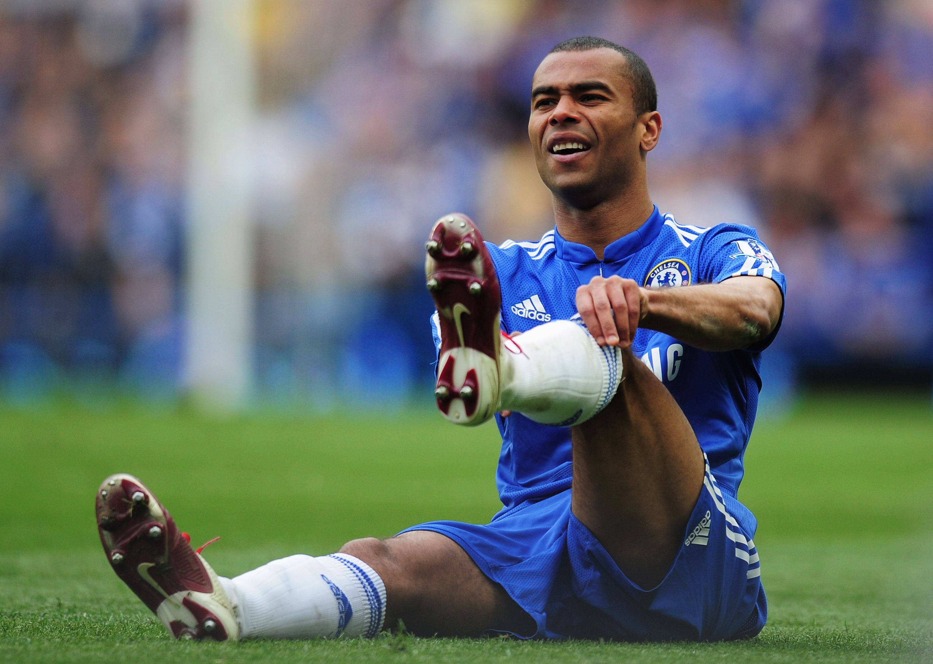 LONDON, ENGLAND - MAY 09:  Ashley Cole of Chelsea adjusts his socks during the Barclays Premier League match between Chelsea and Wigan Athletic at Stamford Bridge on May 9, 2010 in London, England.  (Photo by Shaun Botterill/Getty Images)