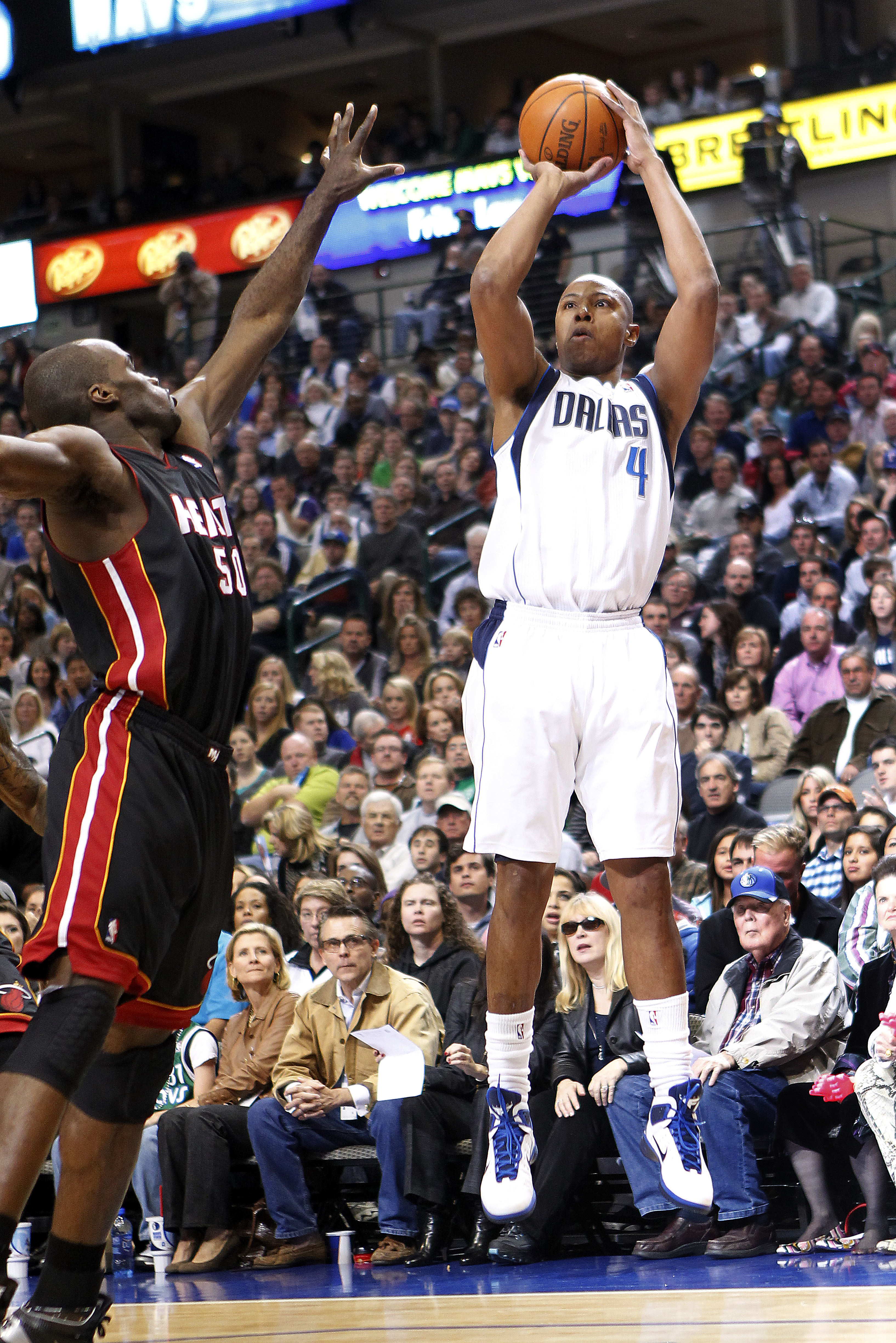 DALLAS - NOVEMBER 27: Caron Butler #4 of the Dallas Mavericks shoots over Joel Anthony #50 of the Miami Heat on November 27, 2010 at the American Airlines Center in Dallas, Texas. NOTE TO USER: User expressly acknowledges and agrees that, by downloading a