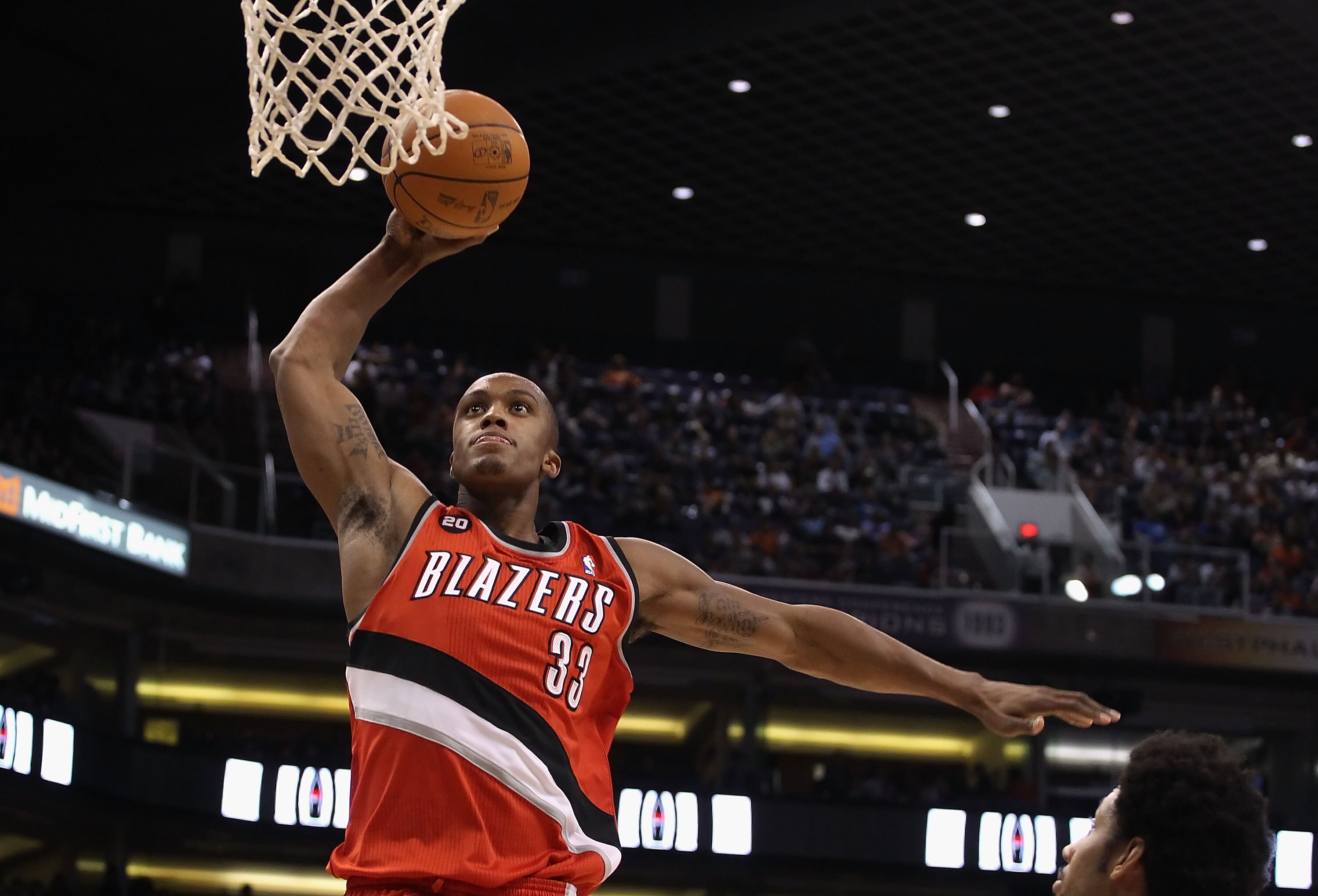 PHOENIX - DECEMBER 10:  Dante Cunningham #33 of the Portland Trail Blazers slam dunks the ball against the Phoenix Suns during the NBA game at US Airways Center on December 10, 2010 in Phoenix, Arizona. The Trail Blazers defeated the Suns 101-94.  NOTE TO