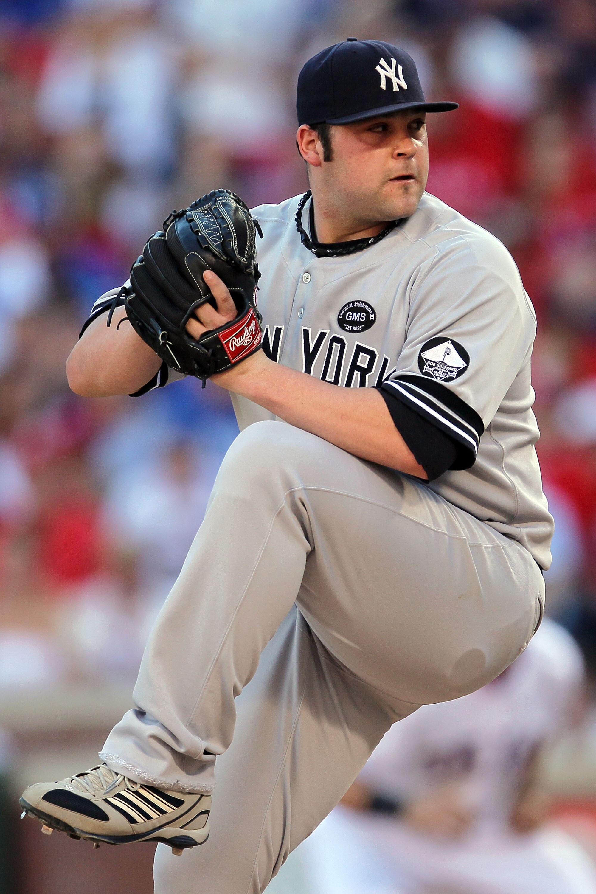ARLINGTON, TX - OCTOBER 16:  Joba Chamberlain #62 of the New York Yankees throws a pitch against the Texas Rangers in Game Two of the ALCS during the 2010 MLB Playoffs at Rangers Ballpark in Arlington on October 16, 2010 in Arlington, Texas.  (Photo by St