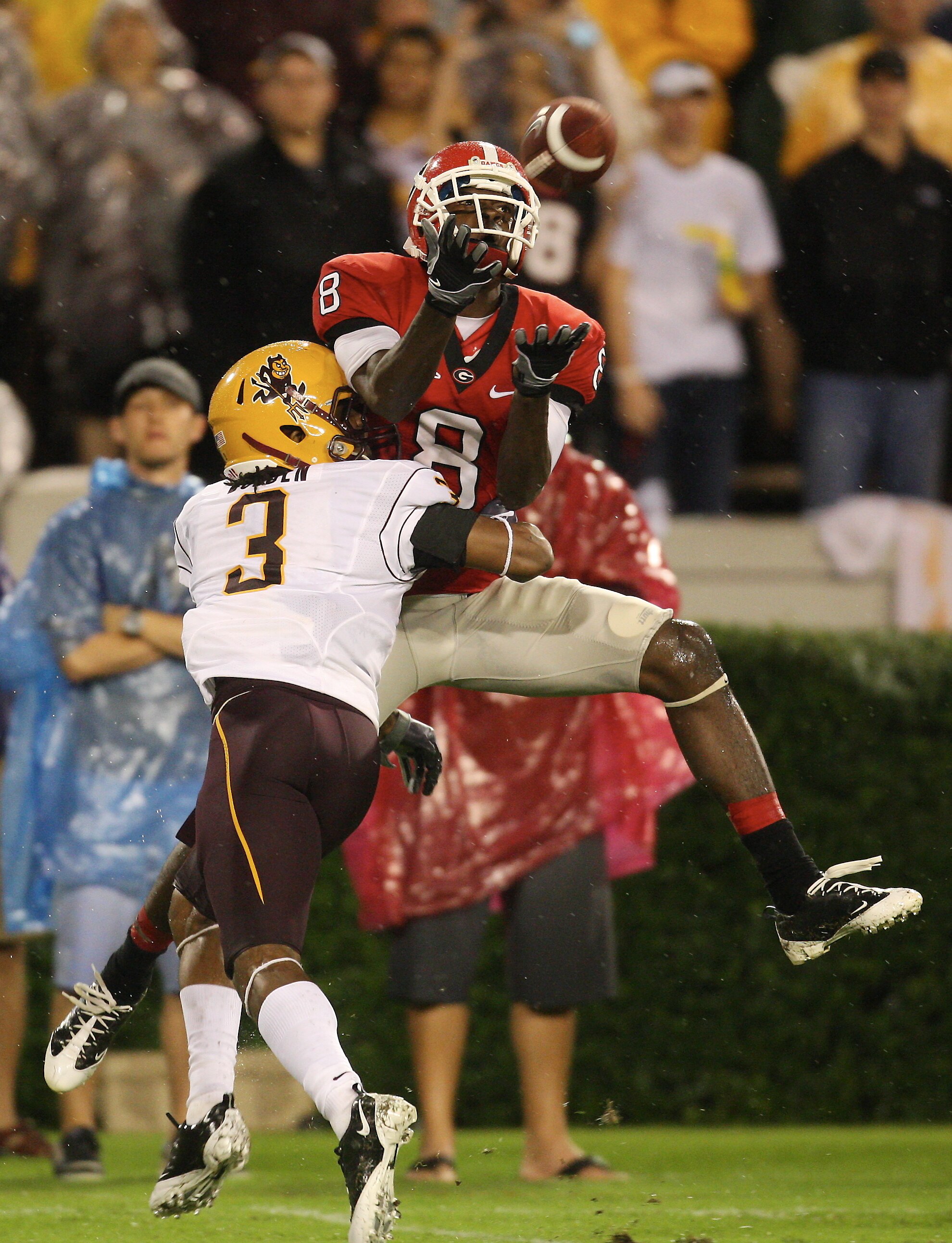 ATHENS, GA - SEPTEMBER 26: A. J. Green #8 of the Georgia Bulldogs goes up for a pass against Omar Bolden #3 of the Arizona State Sun Devils at Sanford Stadium on September 26, 2009 in Athens, Georgia. (Photo by Scott Cunningham/Getty Images)