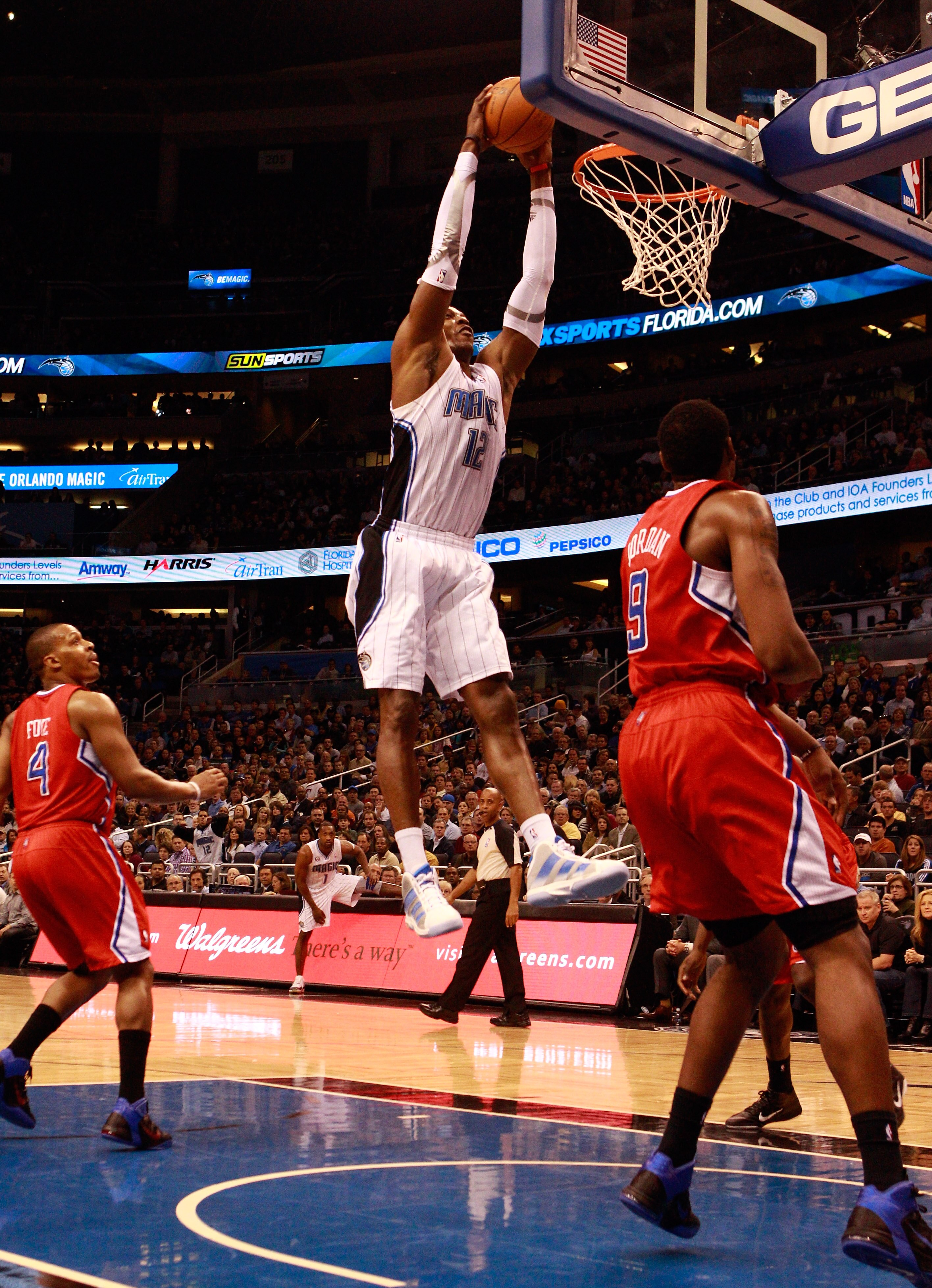 ORLANDO, FL - FEBRUARY 08:  Dwight Howard #12 of the Orlando Magic attempts a shot attempts a shot during a game against the Los Angeles Clippers at Amway Arena on February 8, 2011 in Orlando, Florida.  NOTE TO USER: User expressly acknowledges and agrees